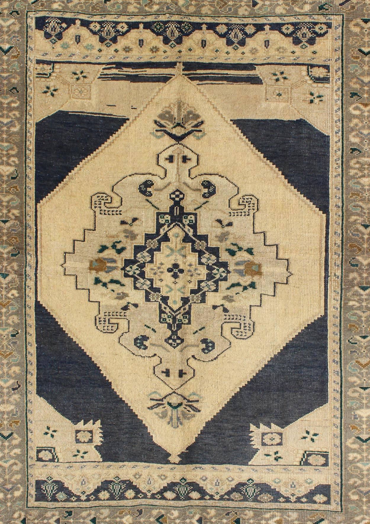 Hand-Knotted Vintage Turkish Oushak Rug with Stylized Medallion in Midnight Blue and Cream For Sale