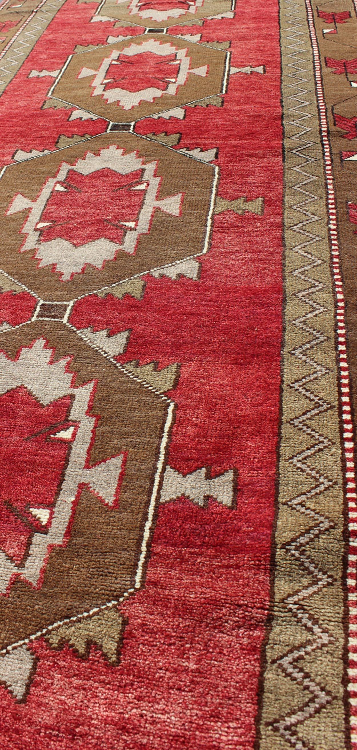 Mid-20th Century Striking Oushak Runner Turkish Vintage with Red and Brown Layered Medallions For Sale