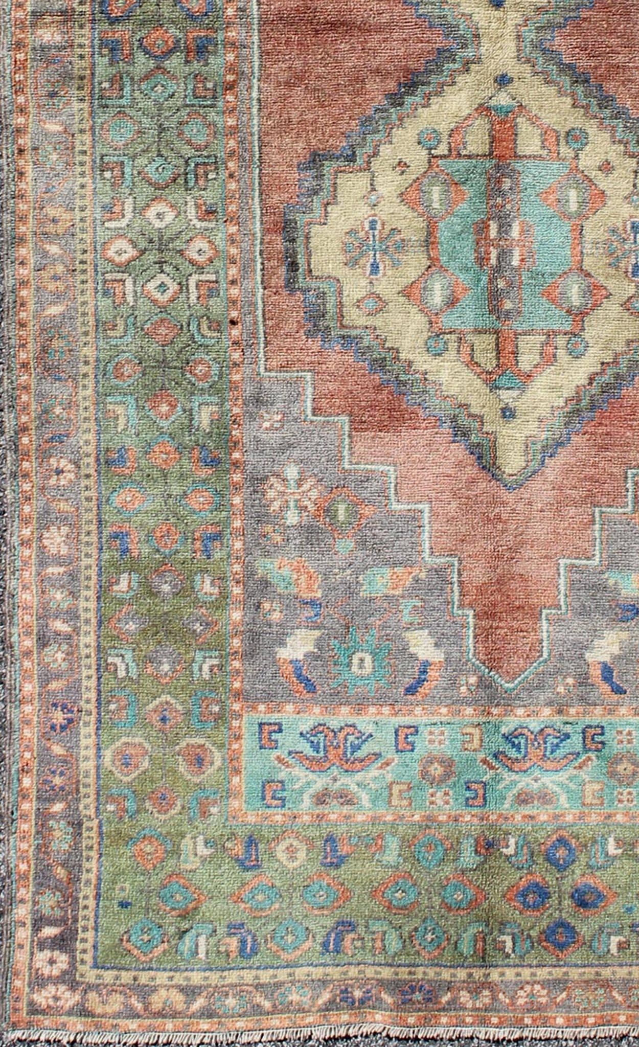 Green and orange Turkish Oushak rug vintage dual diamond medallions, rug tu-en-140417, country of origin / type: Turkey / Oushak, circa 1940

This vintage Turkish Oushak carpet (circa mid-20th century) features a central dual-medallion design, as