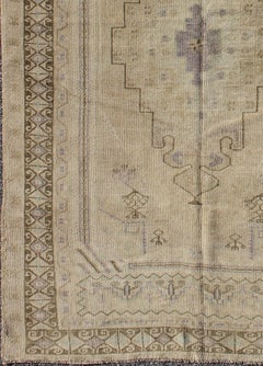 Muted Mid-20th Century Vintage Oushak Rug with Cream-Colored Medallion