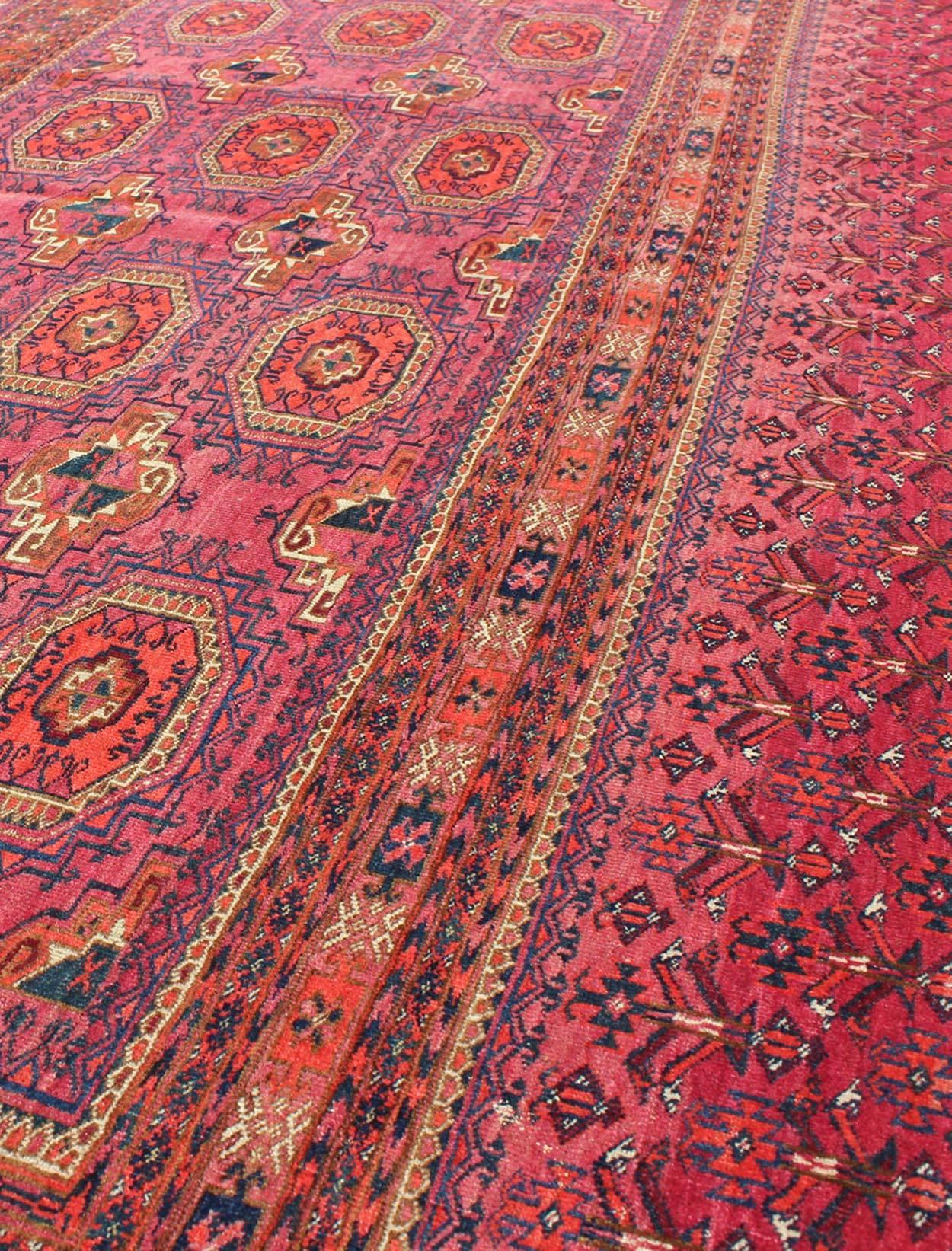 Hand-Knotted Antique Turkoman Tekke Rug with Repeating Medallion Design in Fuchsia
