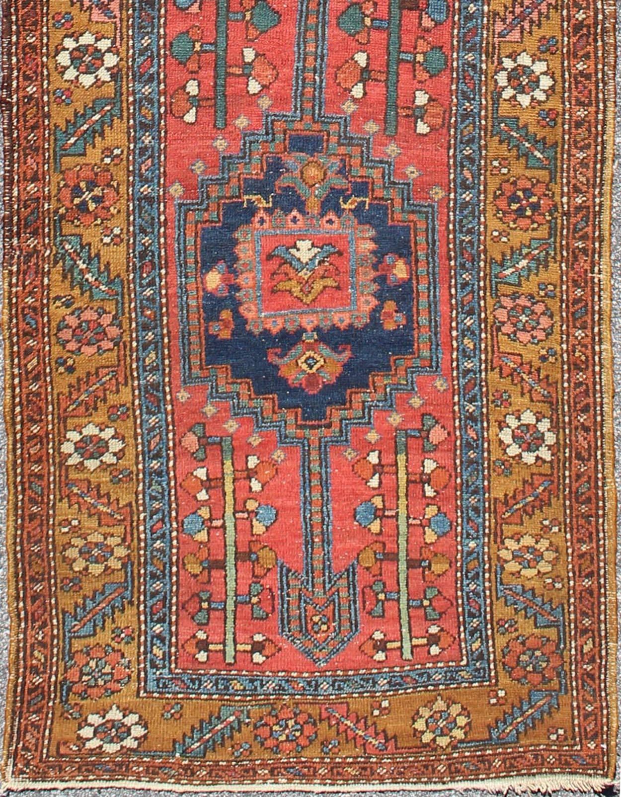 Acid Yellow and Burnt Orange Antique Persian Serapi Runner with Medallions, rug 13-0519, country of origin / type: Iran / Heriz Serapi, circa 1900

This magnificent Heriz Serapi runner from Iran, circa 1900, bears an exquisite design rendered in