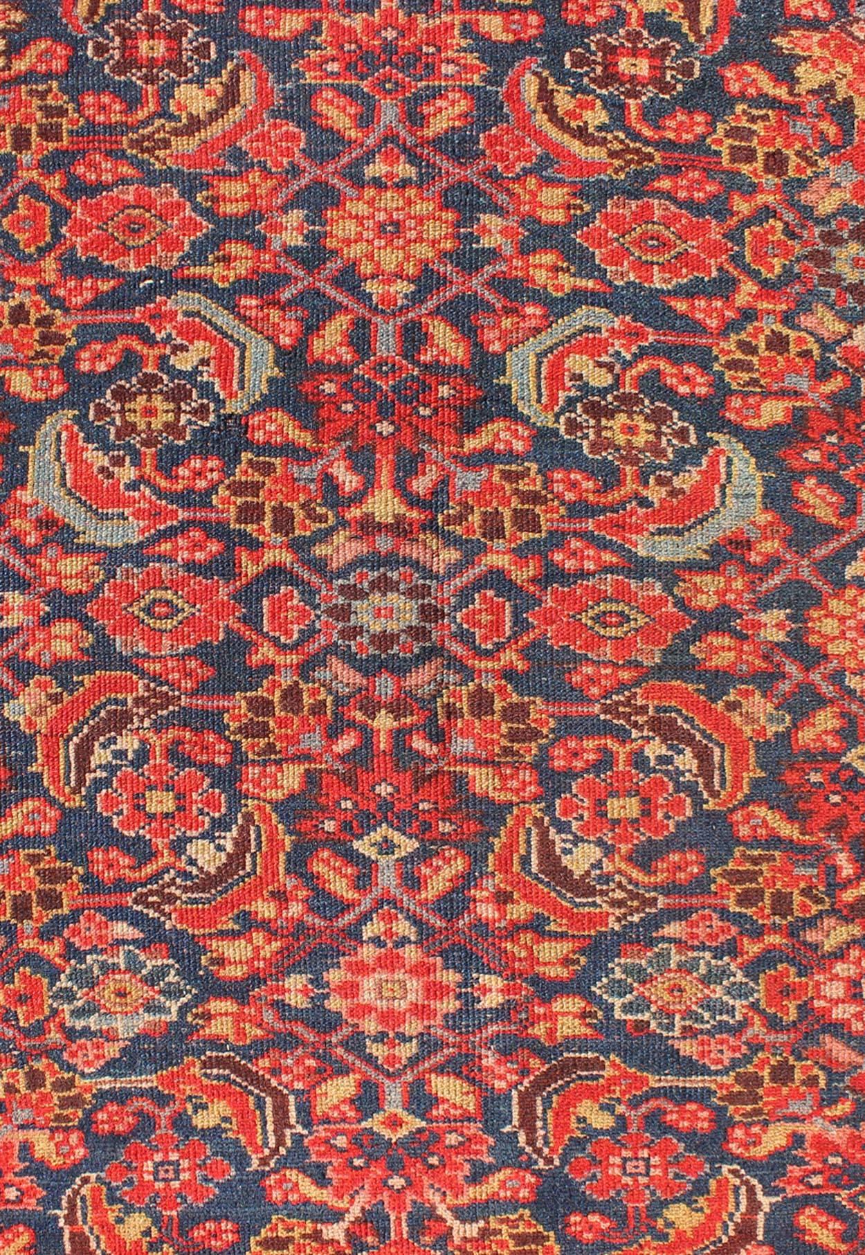 Wool Red and Blue Antique Persian Malayer Rug with All-Over Floral Design For Sale