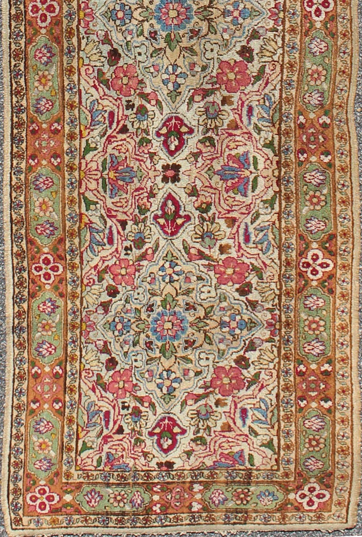 Elegant Ivory Floral Indian Amritsar Antique Runner in Red, Pink, Blue, Green, rug a-0107, country of origin / type: India / Amritsar, circa 1910

Remarkable craftsmanship with regal designs and palette choices came out of India during the 20th