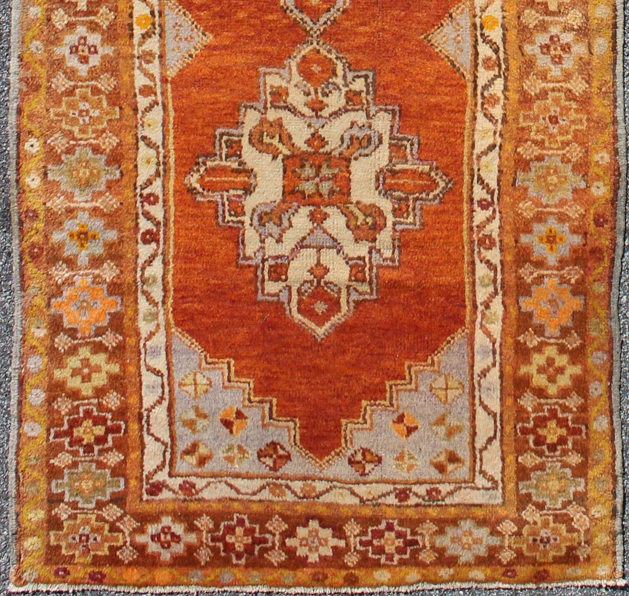 Antique Turkish Oushak runner with geometric diamond medallions, rug en-150, country of origin / type: Turkey / Oushak, circa 1930

This antique Oushak runner features a unique blend of cheerful colors and an intricately beautiful design. The