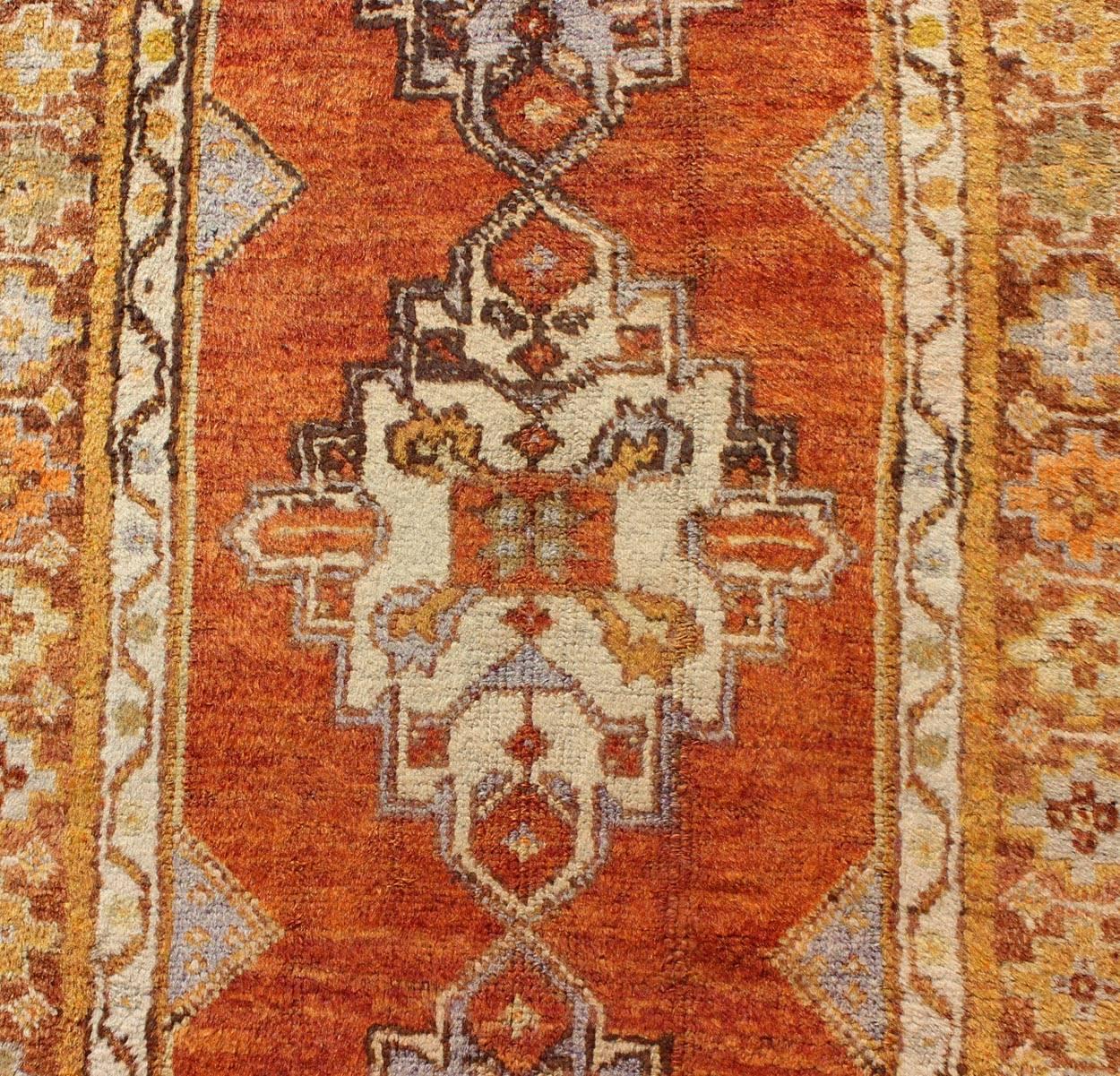 Wool Antique Turkish Oushak Runner with Geometric Diamond Medallions For Sale