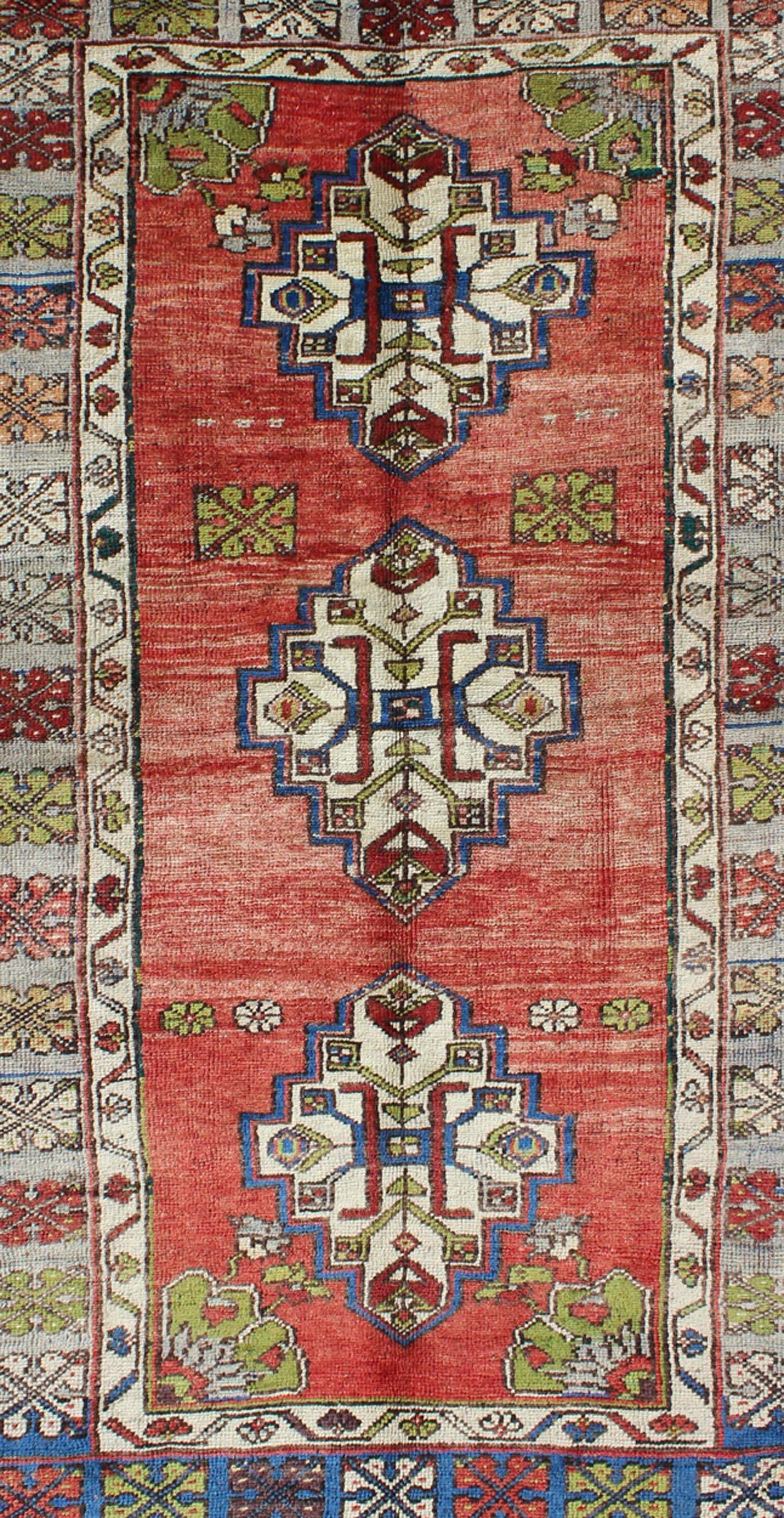 Hand-Knotted Green, Blue and Red Vintage Turkish Oushak Rug with Three Geometric Medallions For Sale