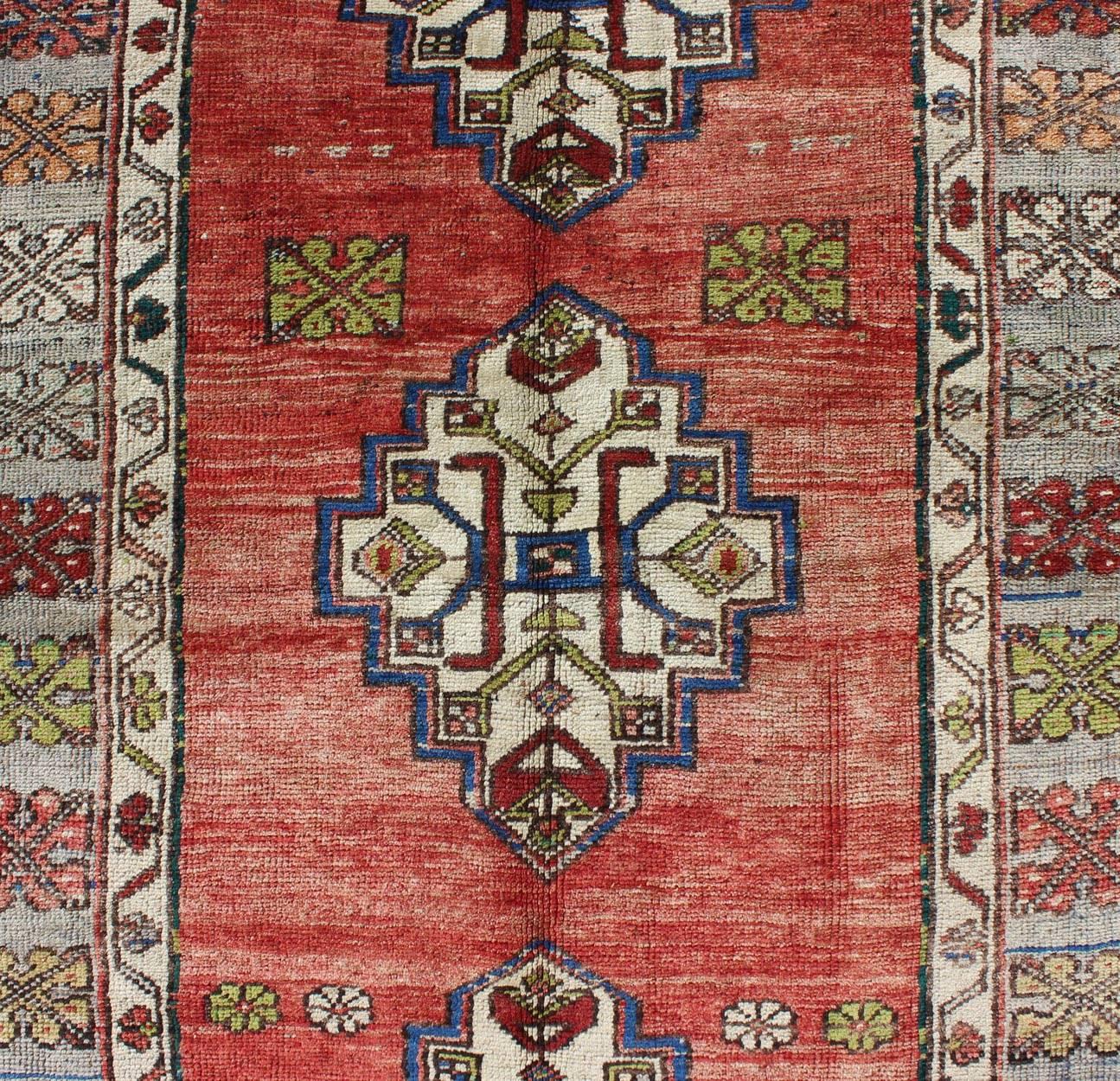 Wool Green, Blue and Red Vintage Turkish Oushak Rug with Three Geometric Medallions For Sale
