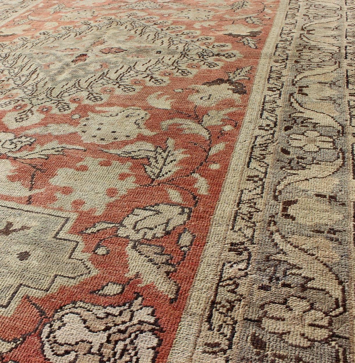 20th Century Antique Turkish Oushak Rug with Geometric Medallion and Floral Designs For Sale