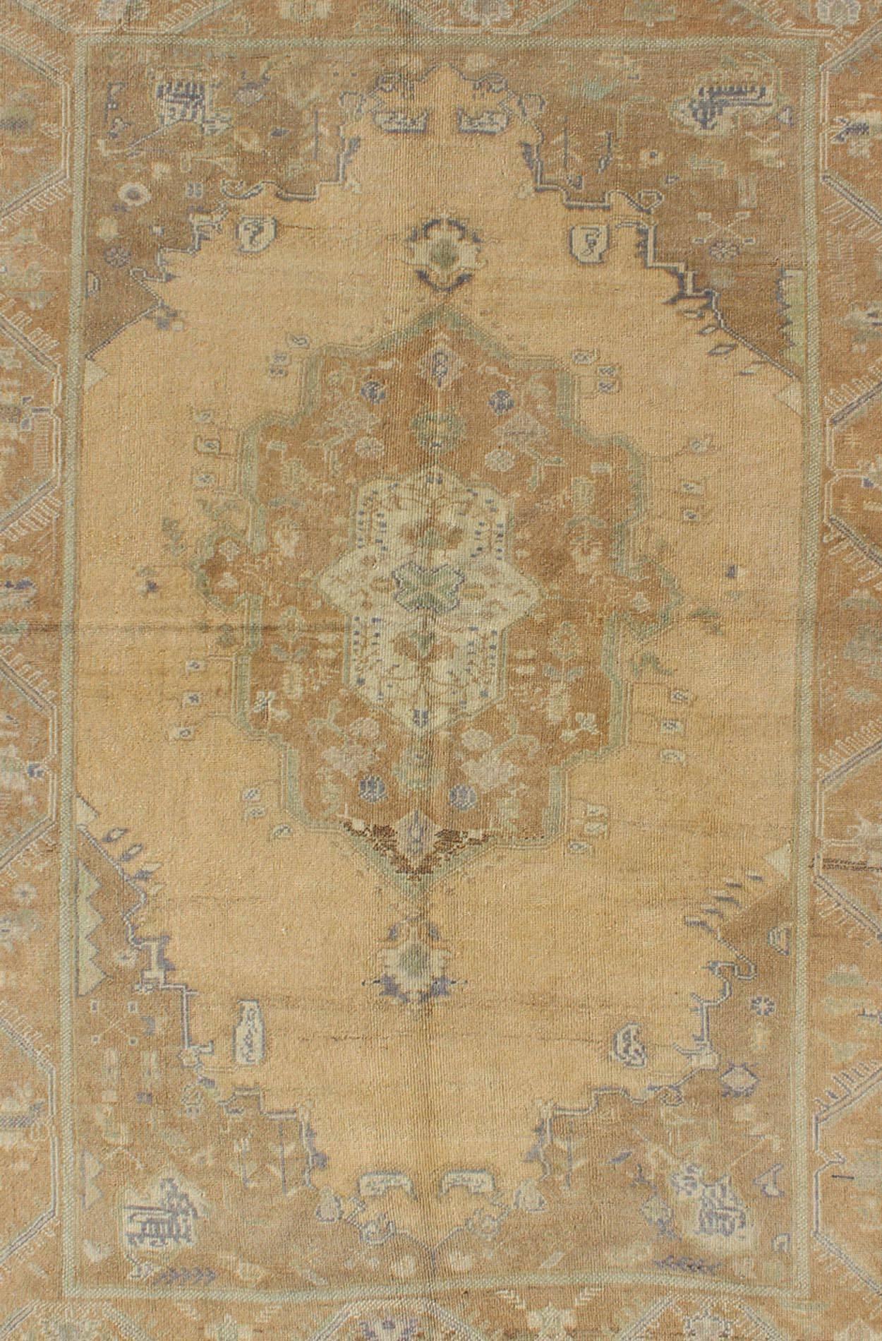 Hand-Knotted Faded Vintage Turkish Oushak Rug with Layered Medallion
