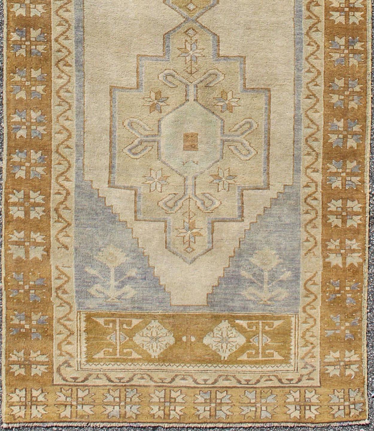 Chartreuse, taupe and ivory Vintage Turkish Oushak runner with Three Medallions, rug en-905, country of origin / type: Turkey / Oushak, circa 1930.

This vintage Turkish Oushak gallery rug (circa 1930) features a unique blend of colors and an