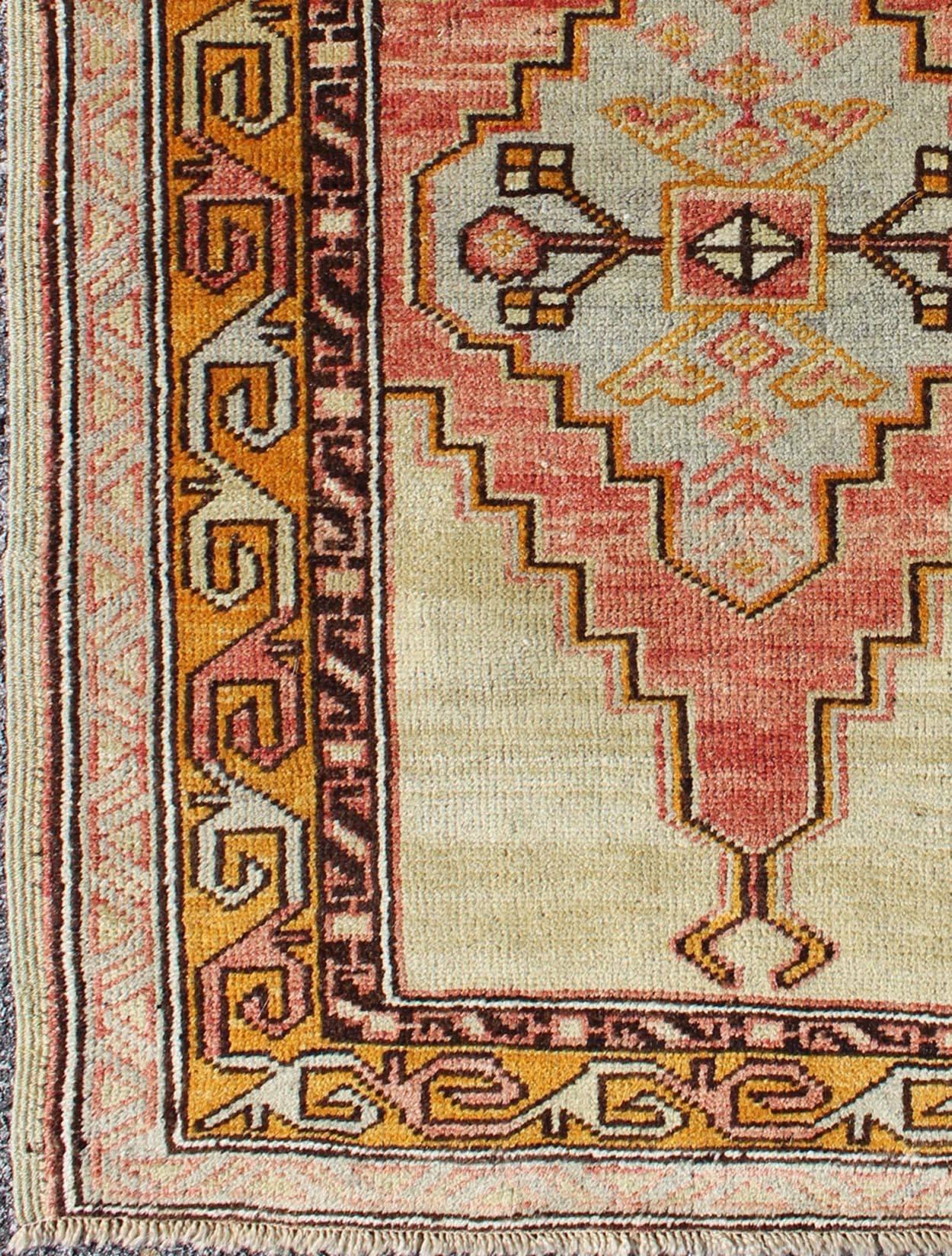 Colorful stylized antique Turkish Oushak rug with layered tribal medallion, rug en-112395, country of origin / type: Turkey / Oushak, circa 1920

This antique Turkish Oushak rug features an intricately beautiful design with a tribal aesthetic. The