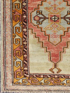 Colorful Stylized Antique Turkish Oushak Rug with Layered Tribal Medallion