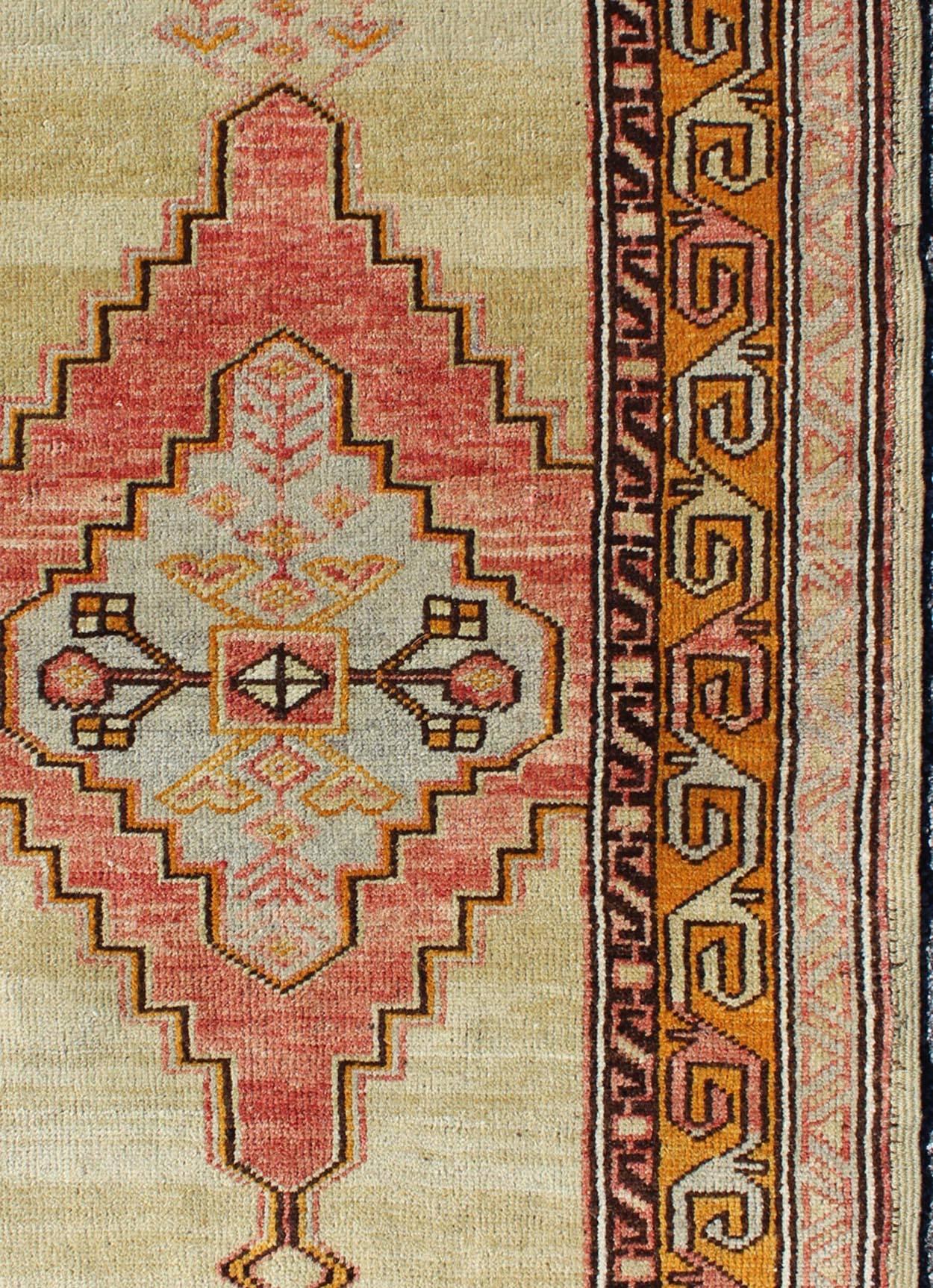Colorful Stylized Antique Turkish Oushak Rug with Layered Tribal Medallion In Excellent Condition For Sale In Atlanta, GA