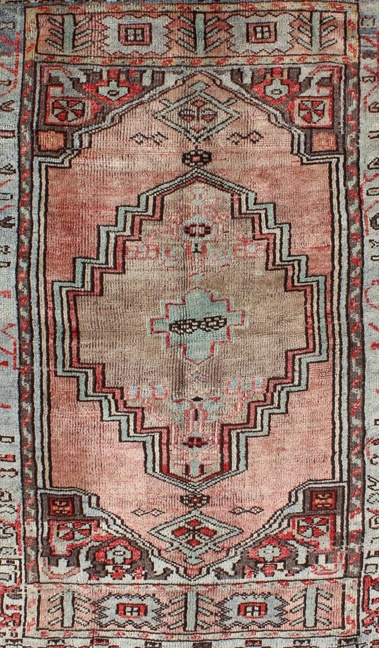 Hand-Knotted Salmon and Pink Vintage Turkish Oushak Rug with Tribal Medallion Design For Sale