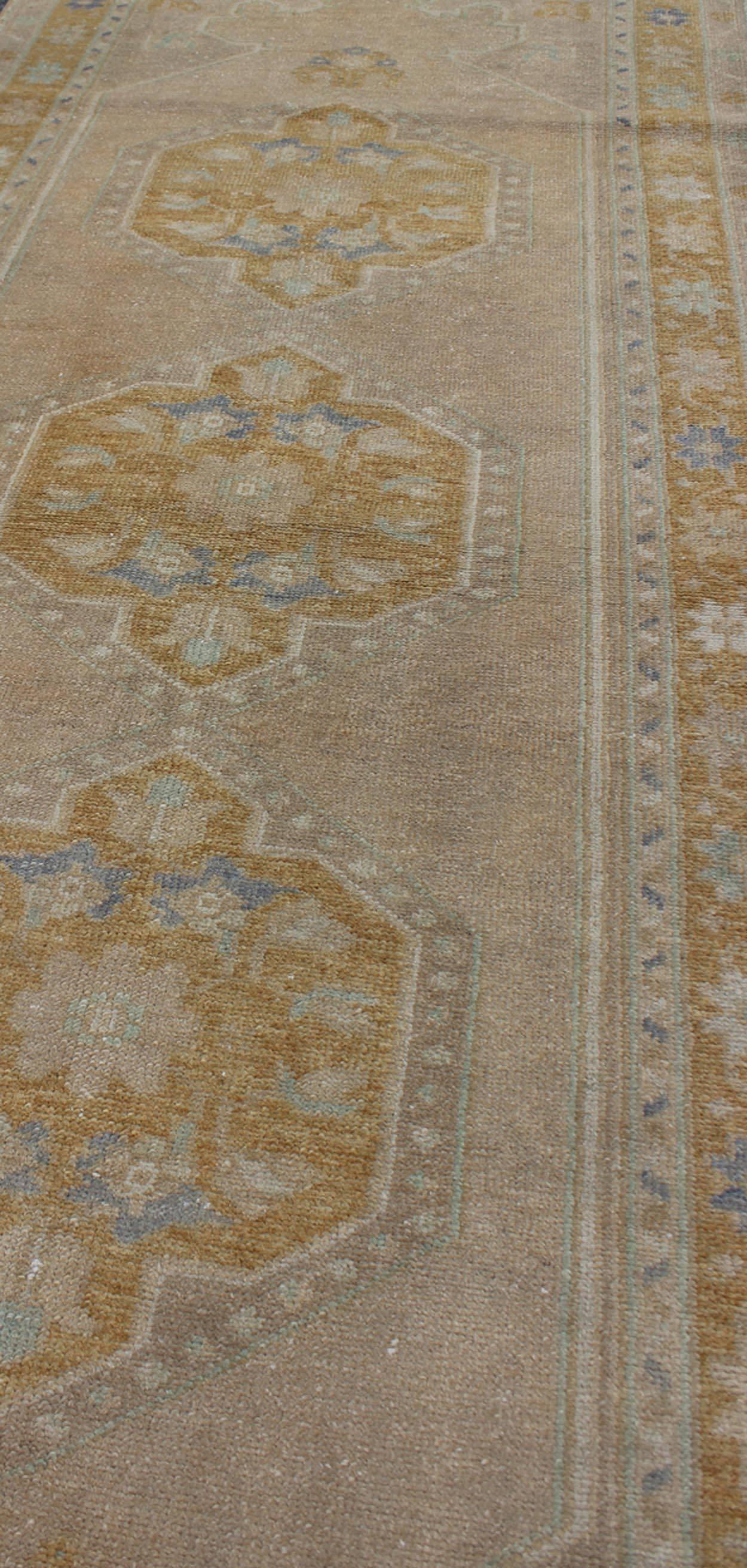 Mid-20th Century Vintage Turkish Oushak Runner with Floral Medallions For Sale