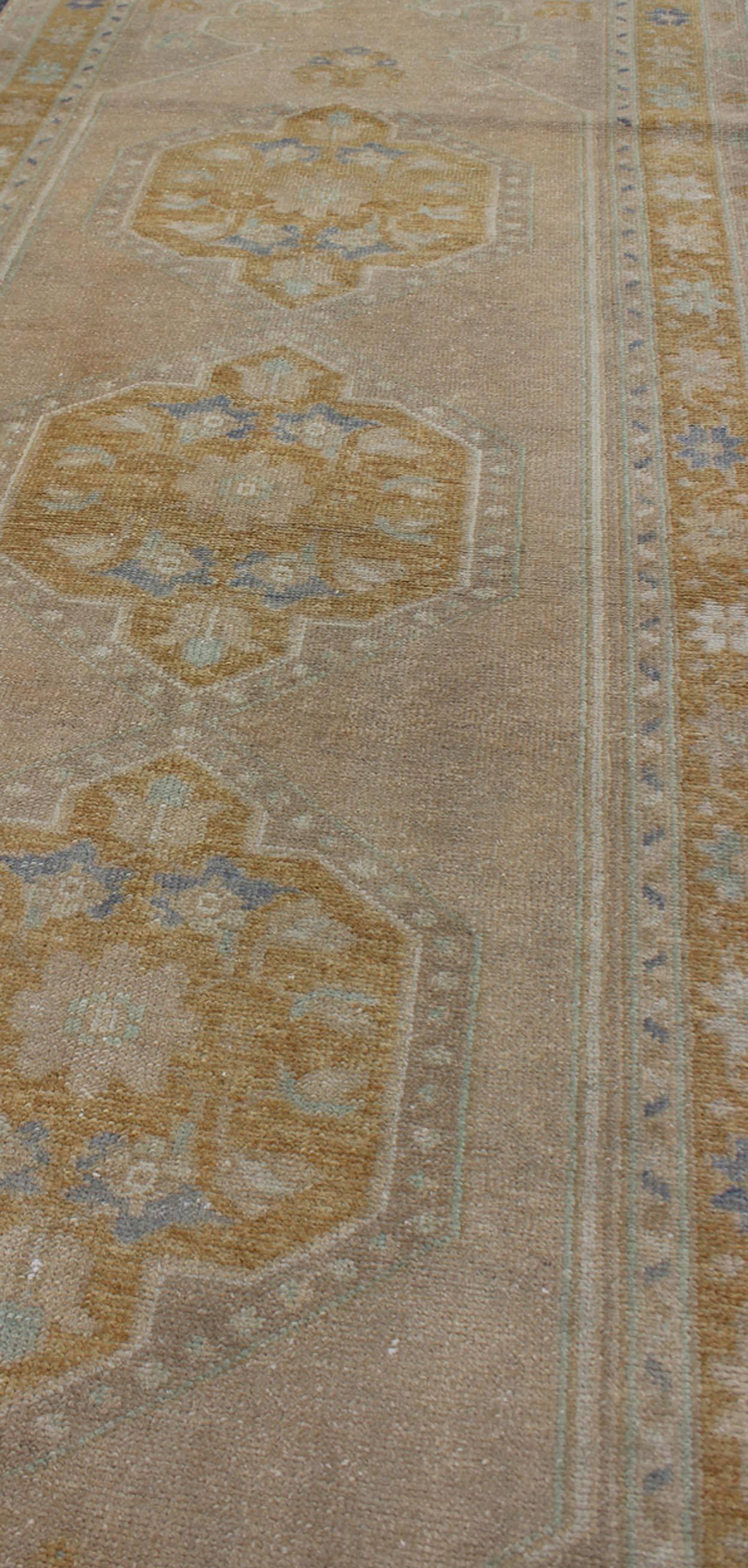 Mid-20th Century  Vintage Turkish Oushak Runner with Floral Medallions For Sale