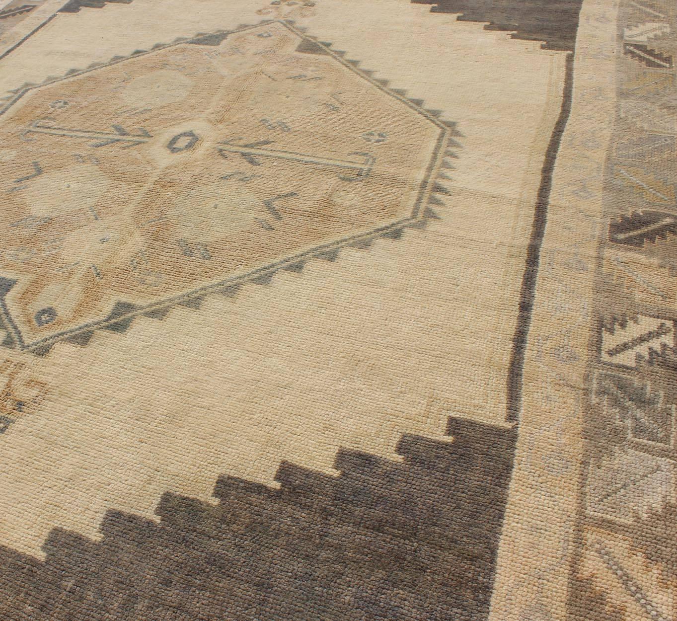 Mid-20th Century Charcoal, Grey and Cream Vintage Turkish Oushak Rug with Tribal Medallion