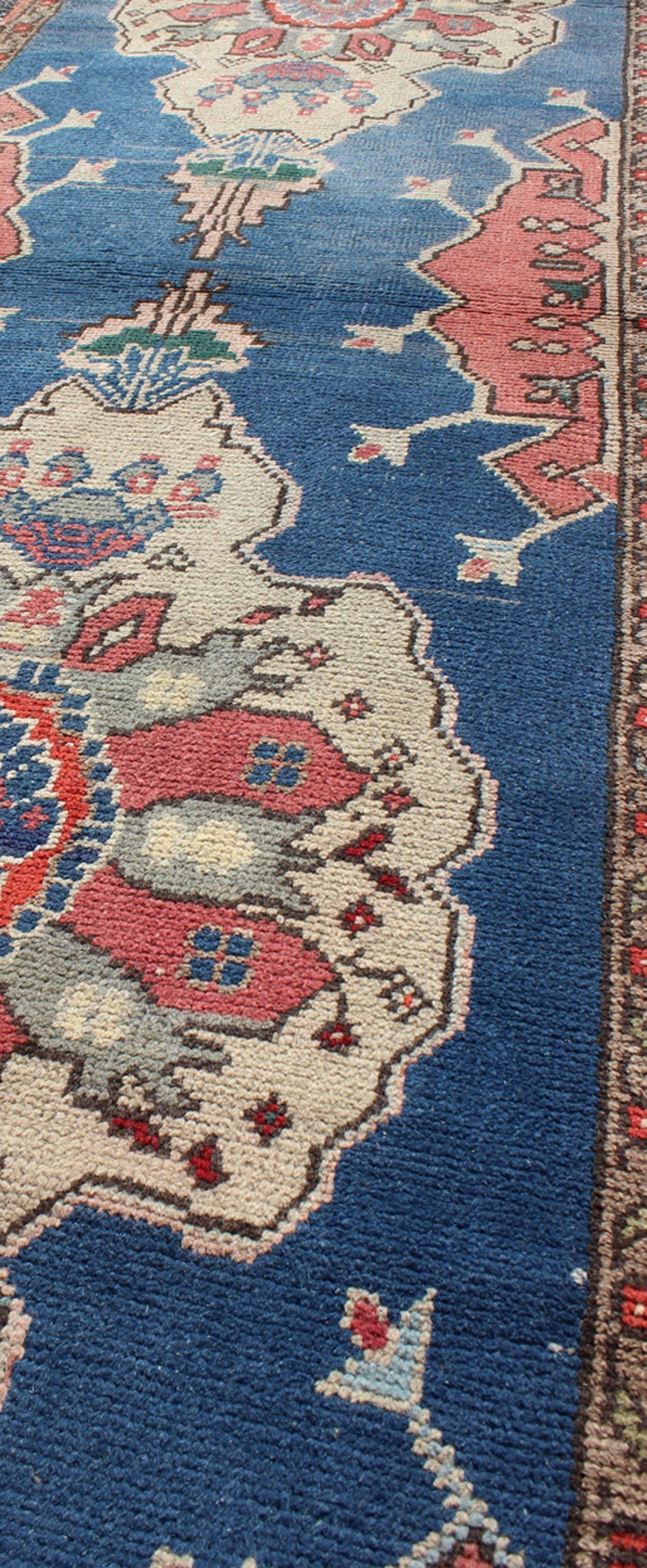 Mid-20th Century Grand Dual Medallion Oushak Vintage Runner from Turkey in Red and Blue For Sale