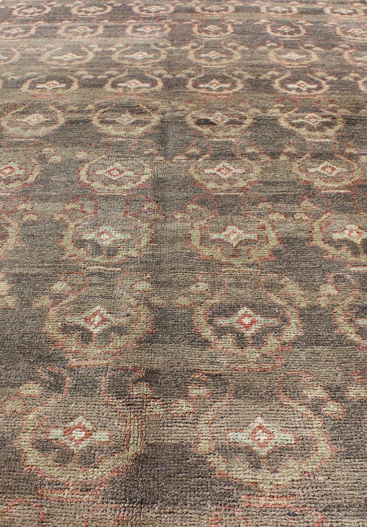 Mid-20th Century Gray Background Vintage Turkish Oushak Rug with All-Over Design in Red and Green For Sale