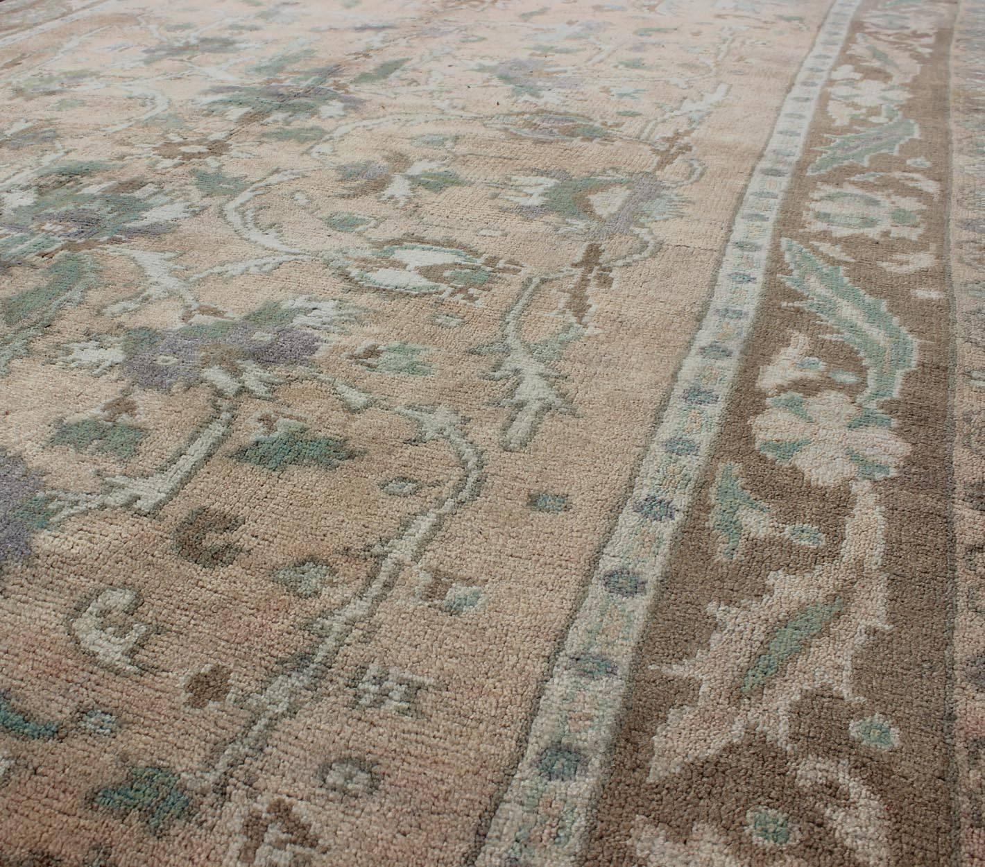 Elegant Floral Vintage Turkish Oushak Rug in Cream, Green, Light Peach and Brown In Good Condition For Sale In Atlanta, GA