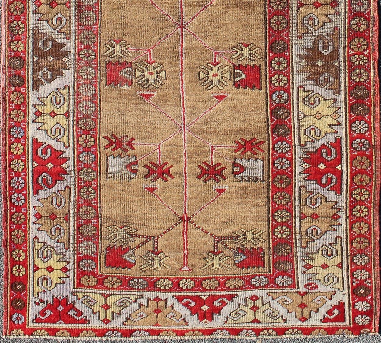 Multicolored antique Turkish Oushak runner with geometrics and flowers, Keivan Woven Arts / rug IS-109, country of origin / type: Turkey / Oushak, circa 1920

This Turkish tribal rug was woven in 1920s, Turkey. The emphasis with these rugs is on