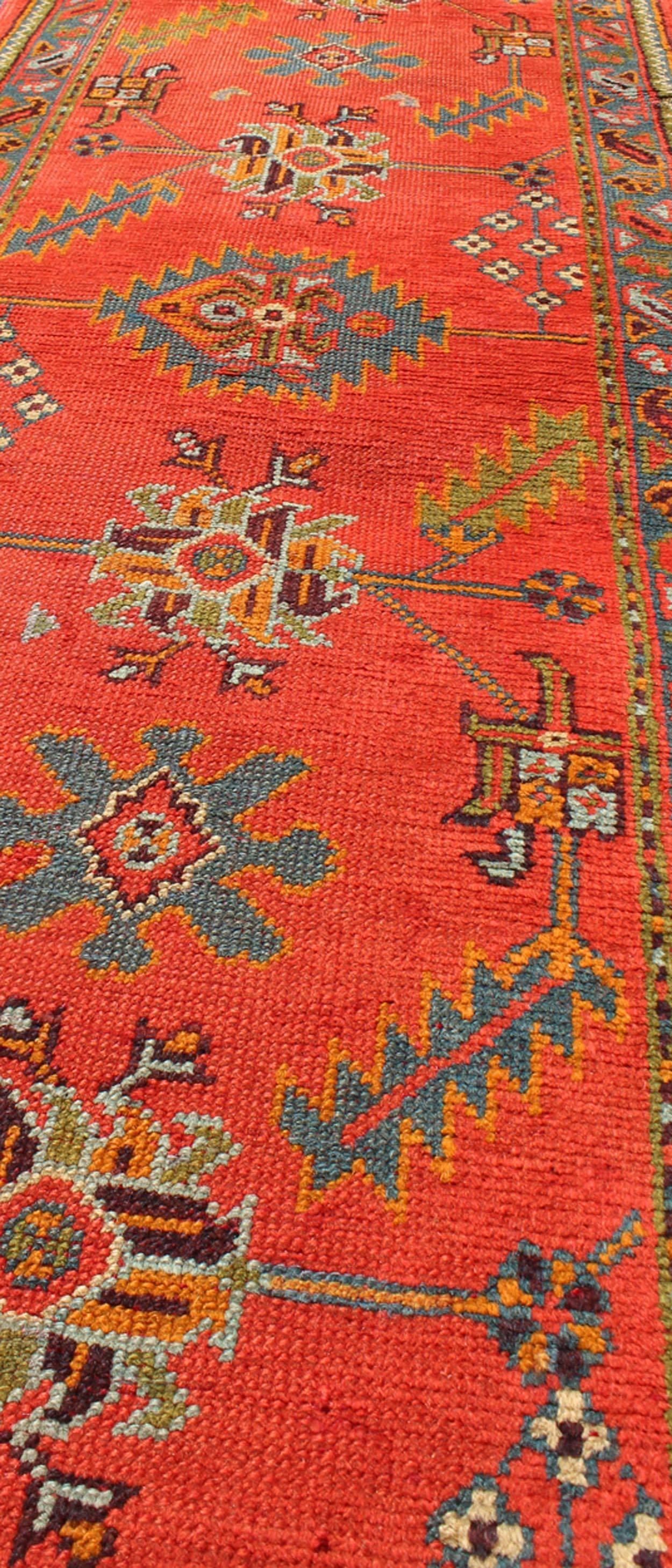 Early 20th Century Bright Red Antique Turkish Oushak Runner with Sub-Geometric Tribal Motifs For Sale