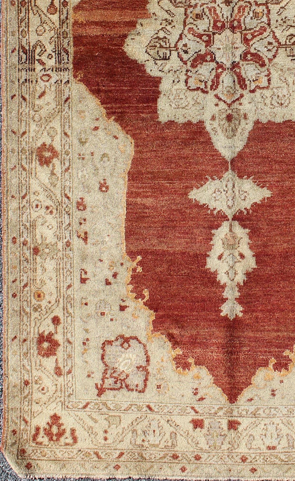 Antique Turkish Oushak rug with stretched medallion in red, ivory, cream, gray, rug na-41519, country of origin / type: Turkey / Oushak, circa 1920

This vintage Turkish Oushak rug features an intricately beautiful design with a traditional