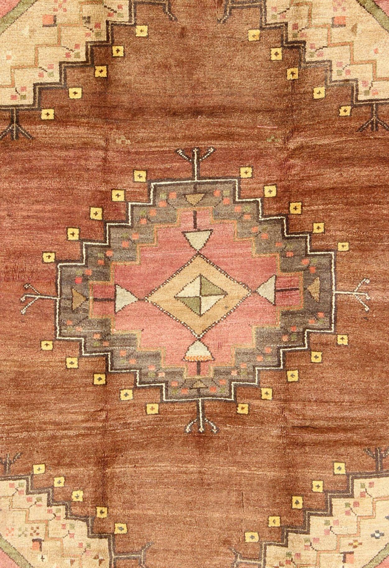 Hand-Knotted Tribal Medallion Vintage Turkish Oushak Rug in Shades of Brown and Red