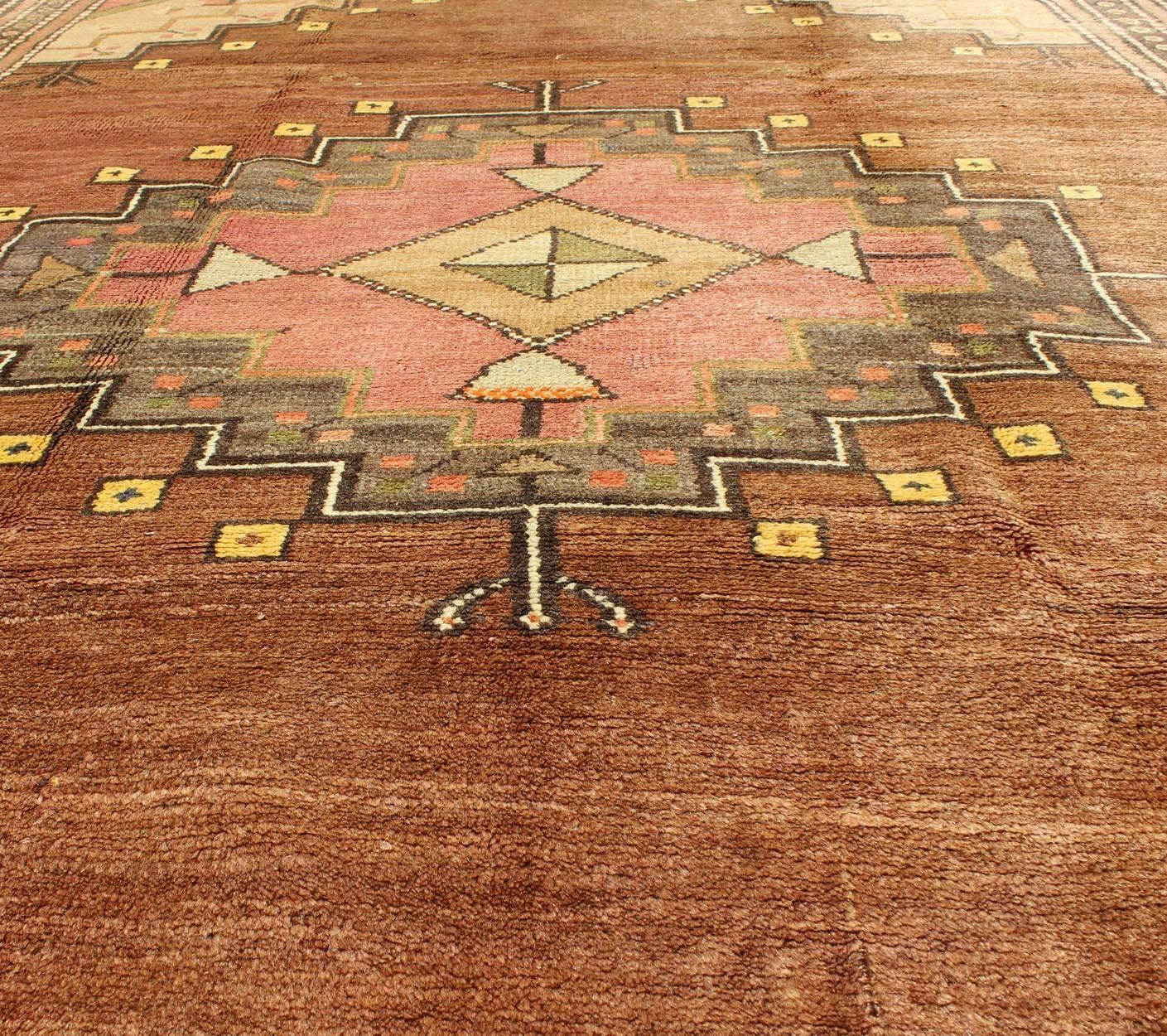 Wool Tribal Medallion Vintage Turkish Oushak Rug in Shades of Brown and Red