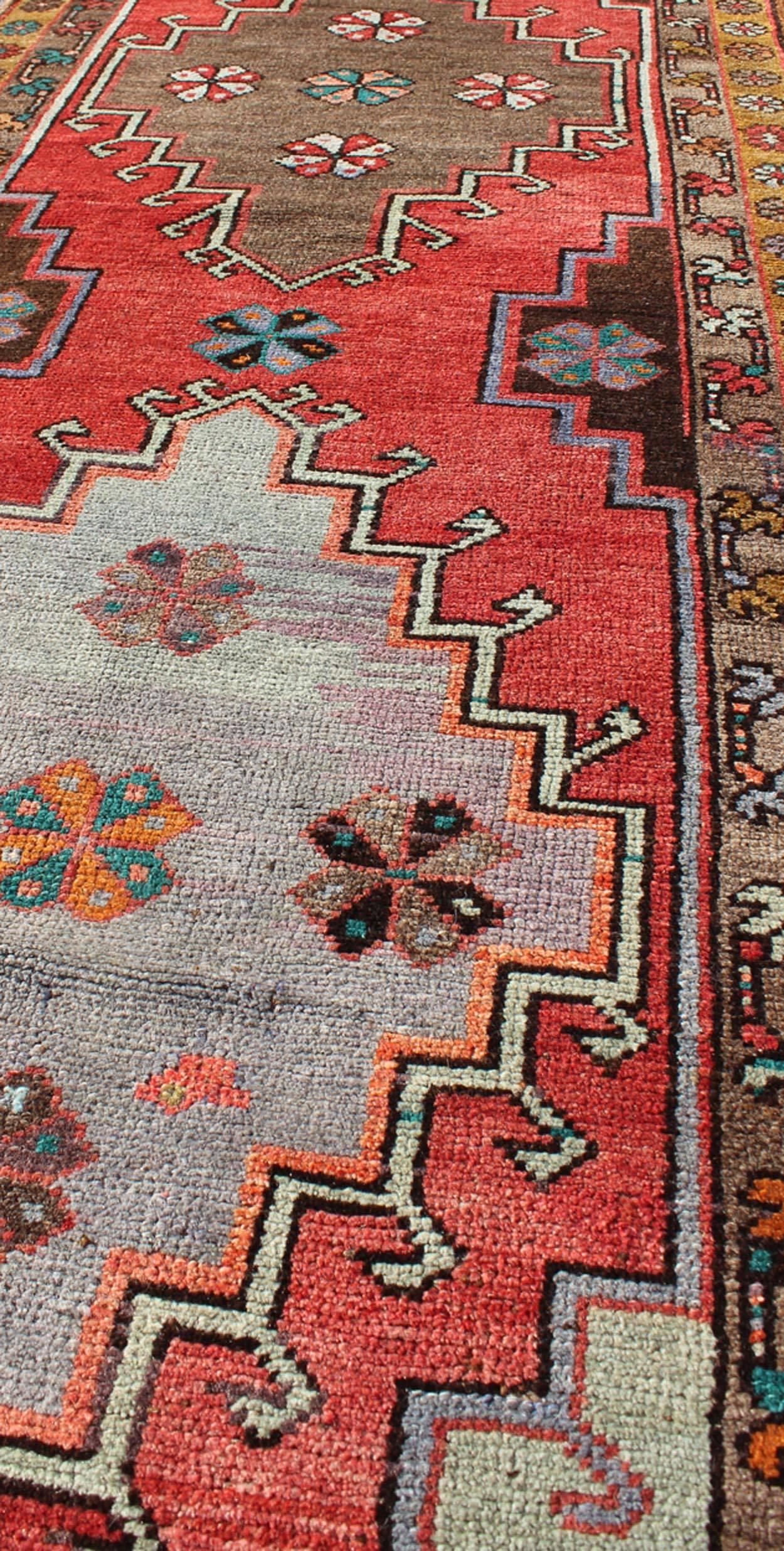 Mid-20th Century Vintage Turkish Oushak Runner with Sub-Geometric Tribal Medallions in Brown, Red For Sale