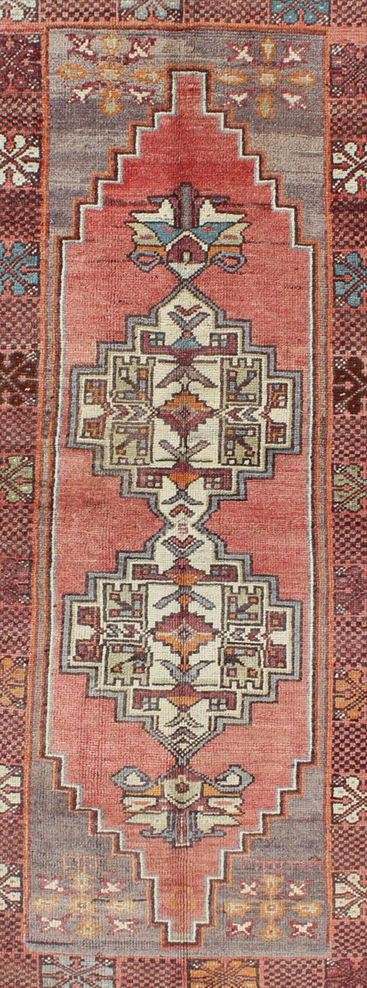 Hand-Knotted Soft Red and Green Vintage Turkish Oushak Rug with Sub-Geometric Dual Medallions For Sale