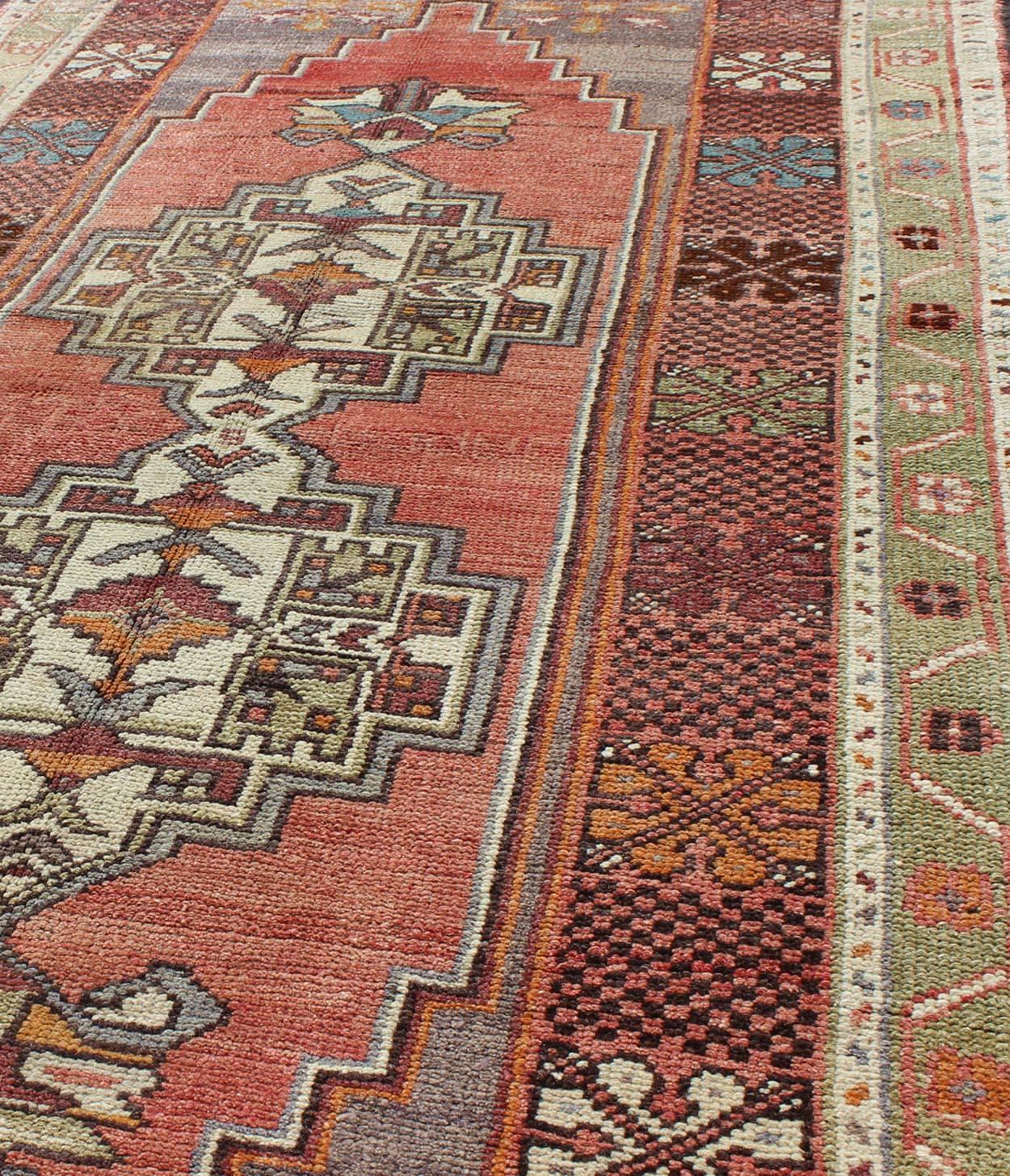 Mid-20th Century Soft Red and Green Vintage Turkish Oushak Rug with Sub-Geometric Dual Medallions For Sale