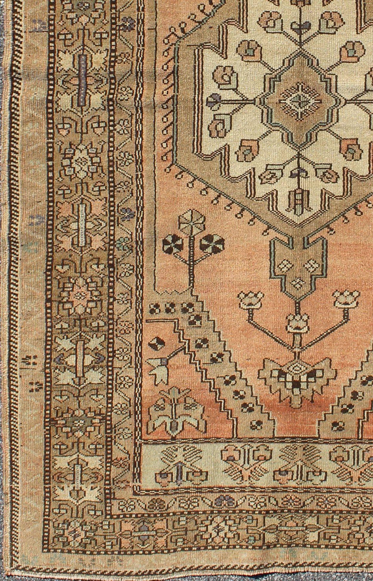 Peach colored floral vintage Turkish Oushak rug with multiple ornate borders, rug tu-trs-95019, country of origin / type: Turkey / Oushak, circa 1940

This vintage Turkish Oushak rug features an intricately beautiful design with a stylized floral