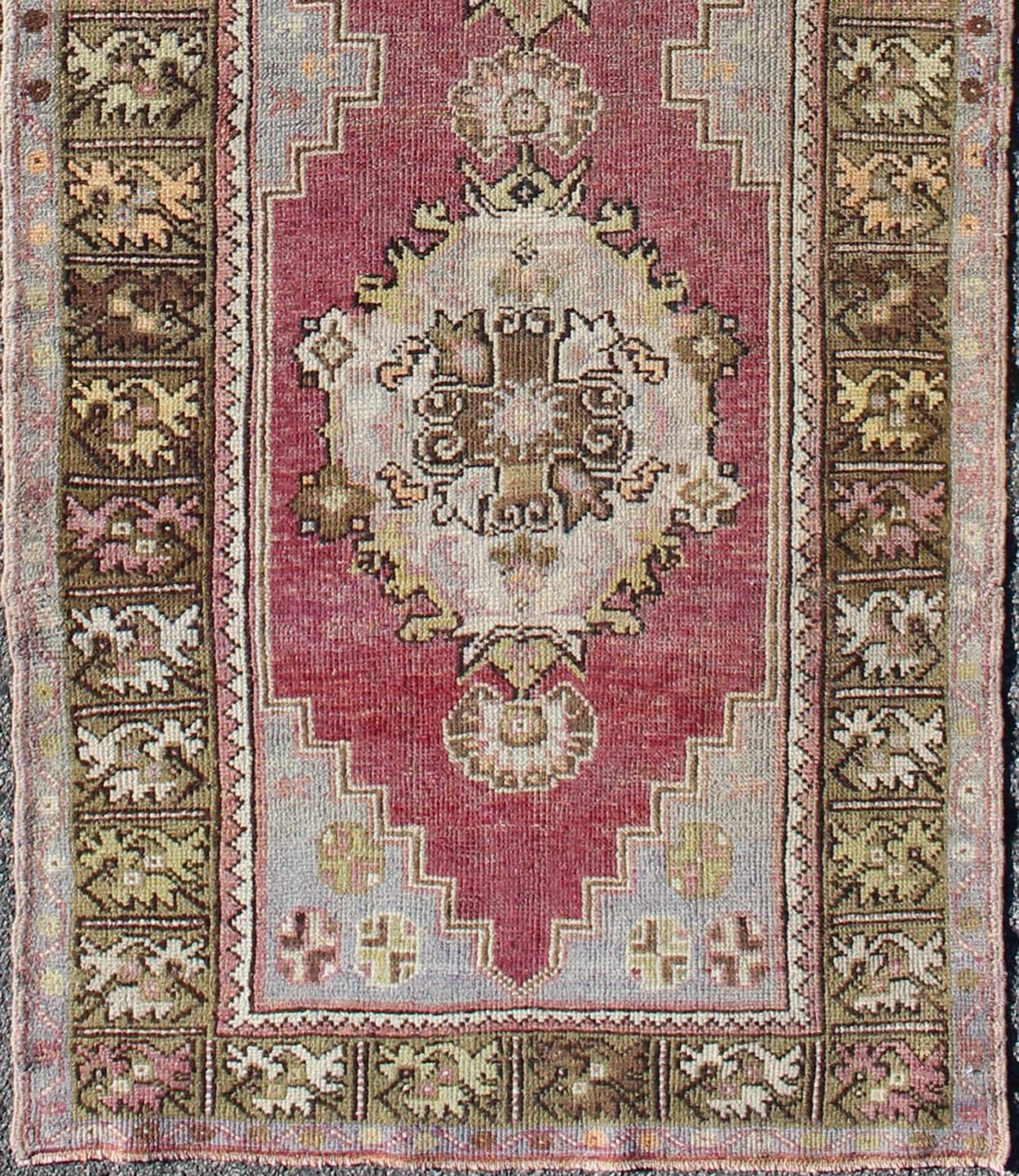 Berry tri-medallion vintage Turkey Oushak runner with gray, camel, blush accents, rug tu-trs-95153, country of origin / type: Turkey / Oushak, circa 1940

This vintage Turkish Oushak runner (circa mid-20th century) features a central tri-medallion