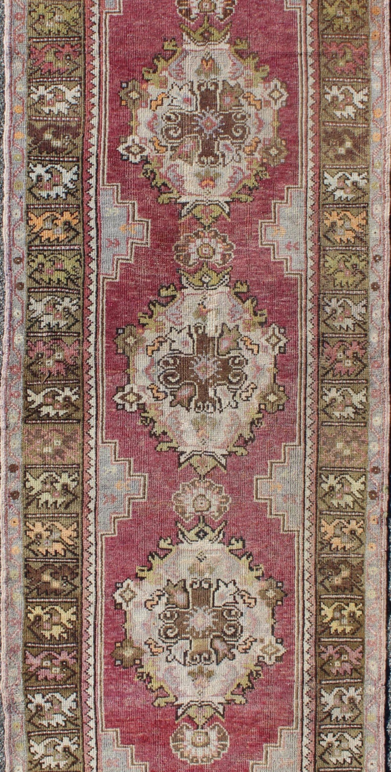 Hand-Knotted Vintage Turkish Oushak Runner with Faded Purple Field and Soft Earth-Tone For Sale