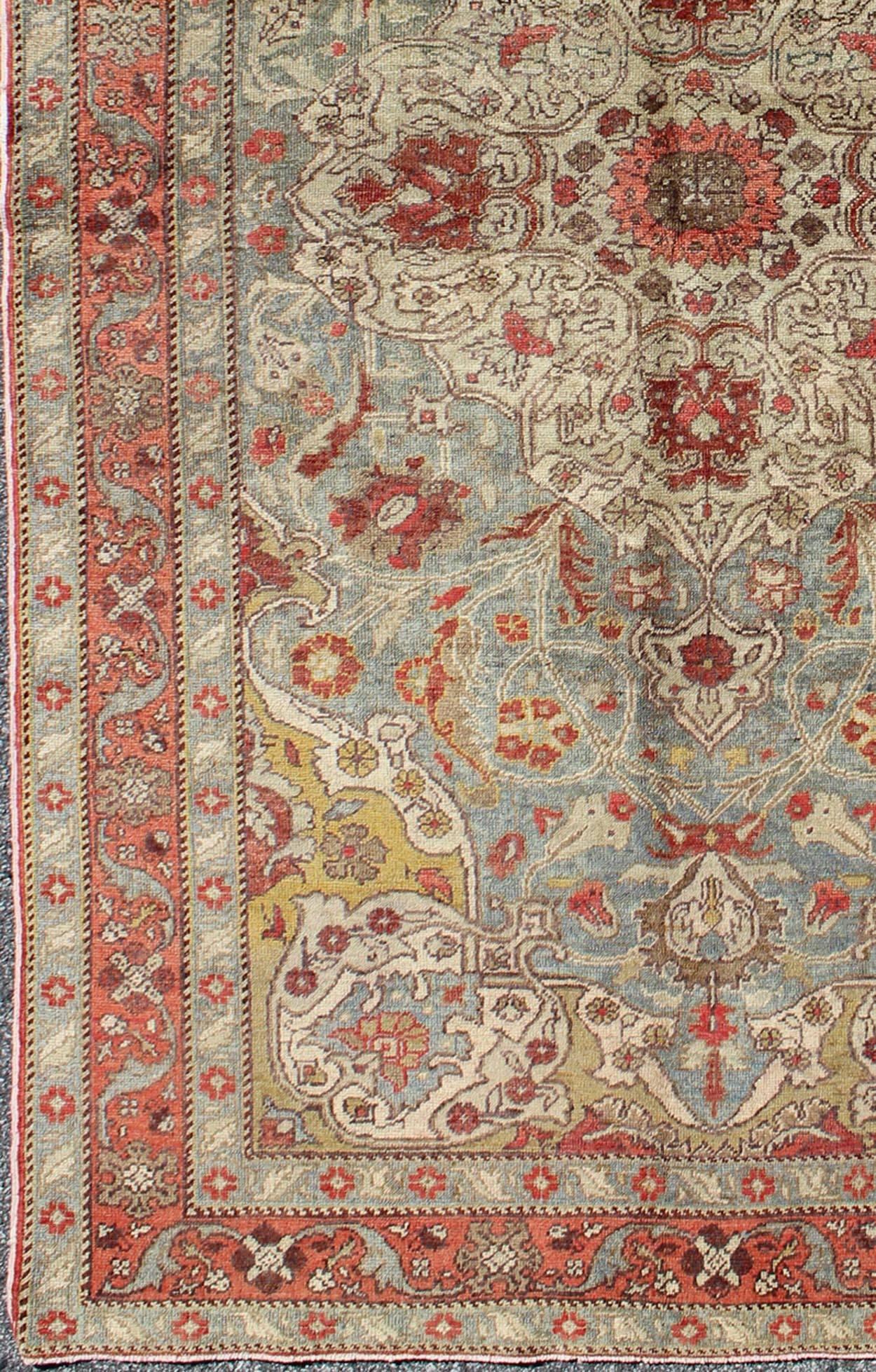 Floral medallion antique Turkey Sivas rug in light blue, red, ivory, chartreuse, rug tu-trs-95198, country of origin / type: Turkey / Oushak, circa 1930.

This antique Turkish Sivas rug features an intricately beautiful design with a floral