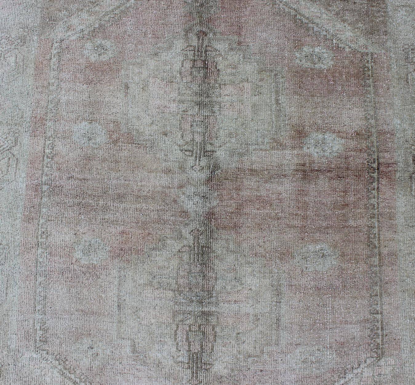 Wool Faded Vintage Turkish Oushak Rug with Central Medallion in Gray and Berry For Sale