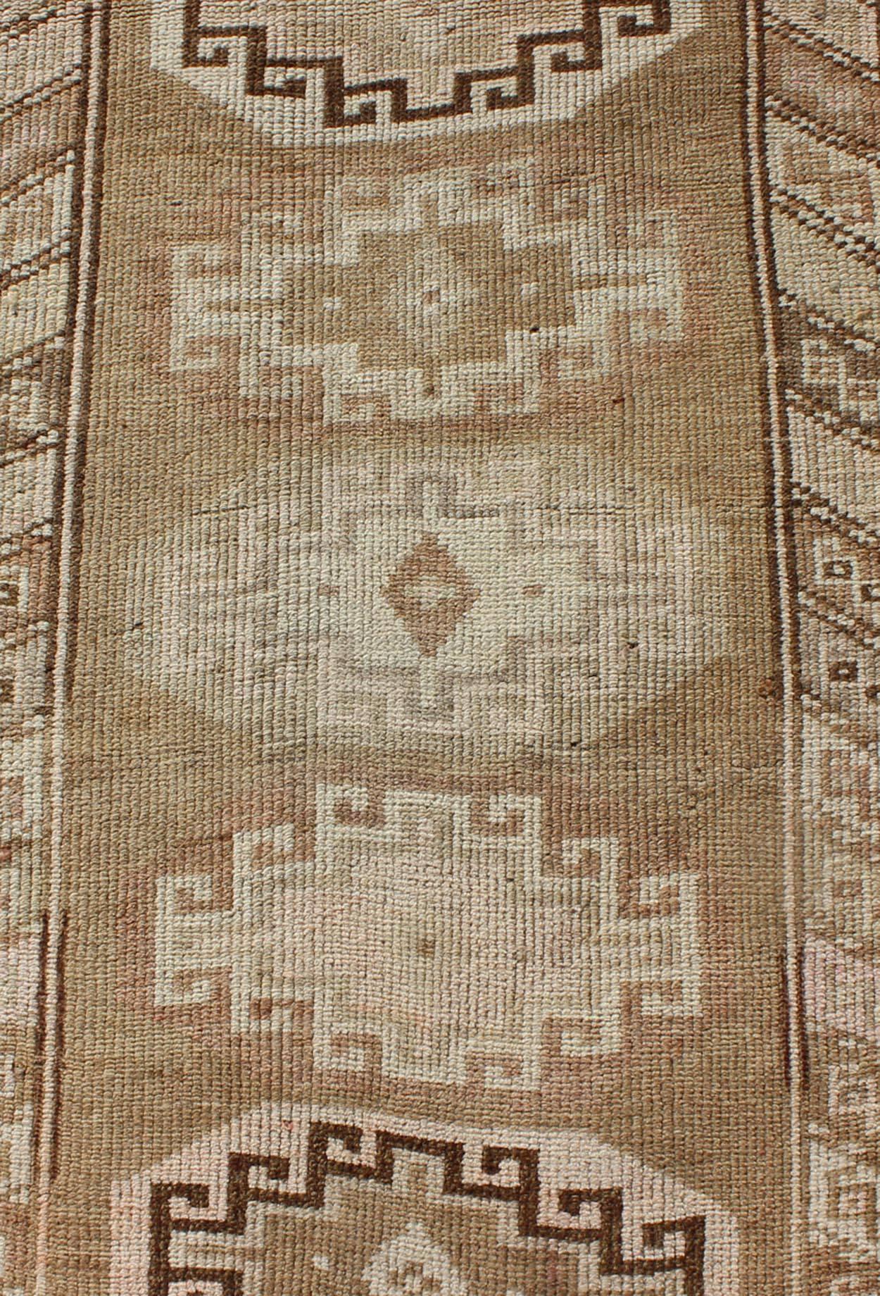 Mid-20th Century Long Vintage Turkish Runner with Taupe, Cream, Brown Stacked Medallions For Sale