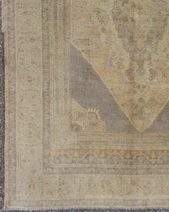 Vintage Turkish Oushak Rug with Faded Peach and Gray Medallion On Soft Taupe