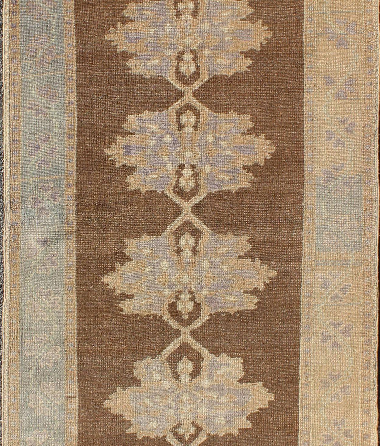 Hand-Knotted Earth-Tone Vintage Turkish Oushak Runner with Blossom Medallion Design For Sale