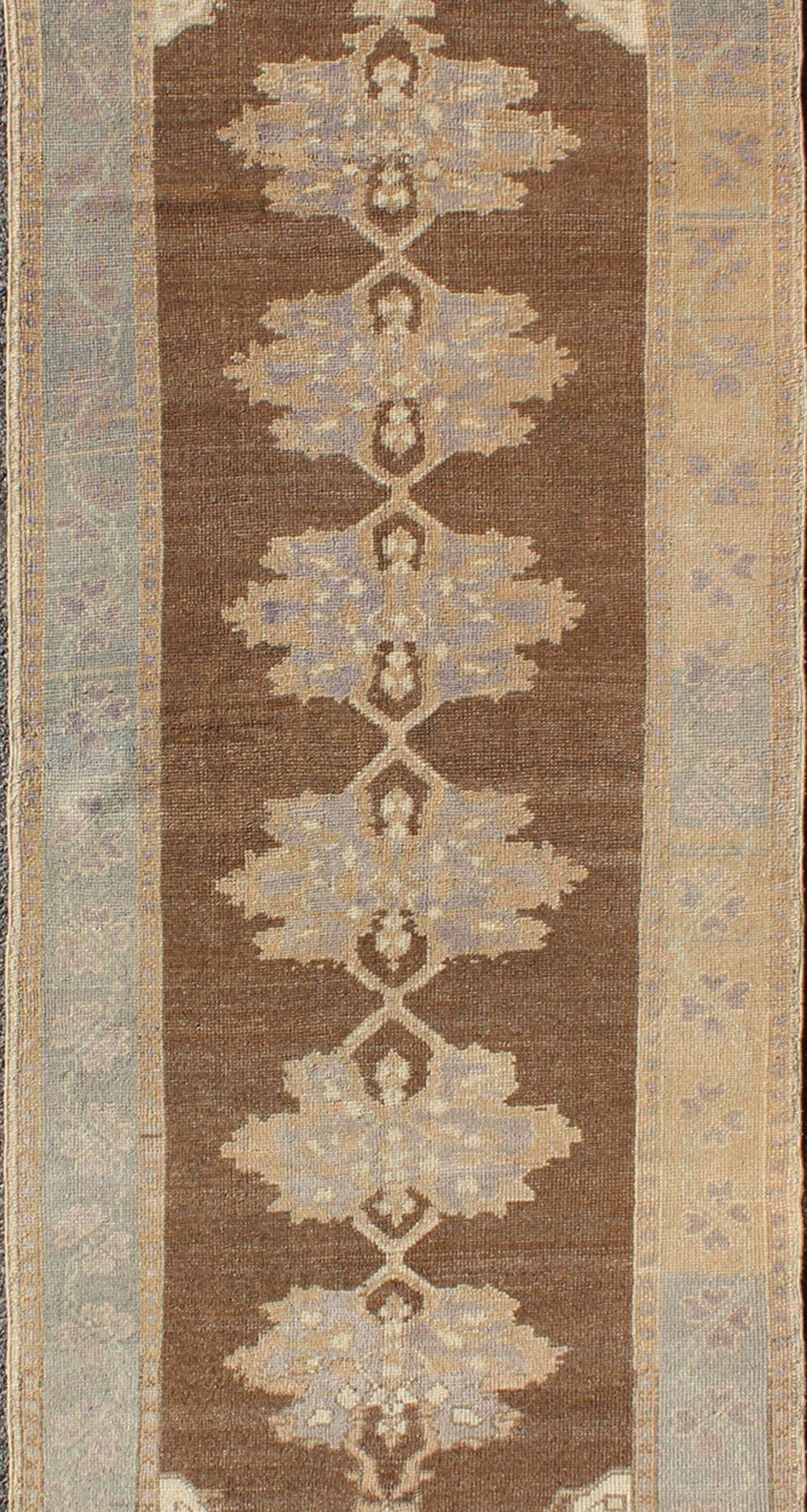 Earth-Tone Vintage Turkish Oushak Runner with Blossom Medallion Design In Good Condition For Sale In Atlanta, GA