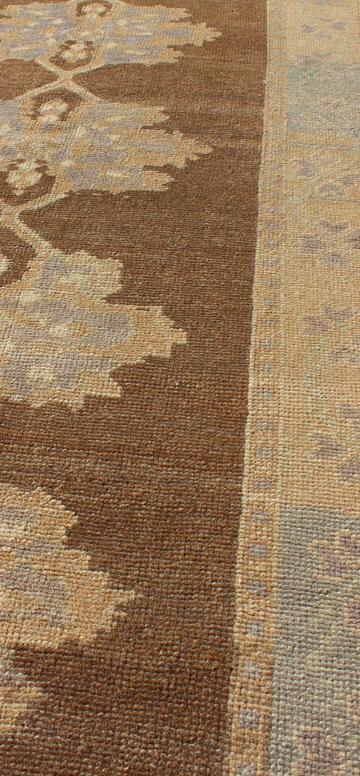 Mid-20th Century Earth-Tone Vintage Turkish Oushak Runner with Blossom Medallion Design For Sale