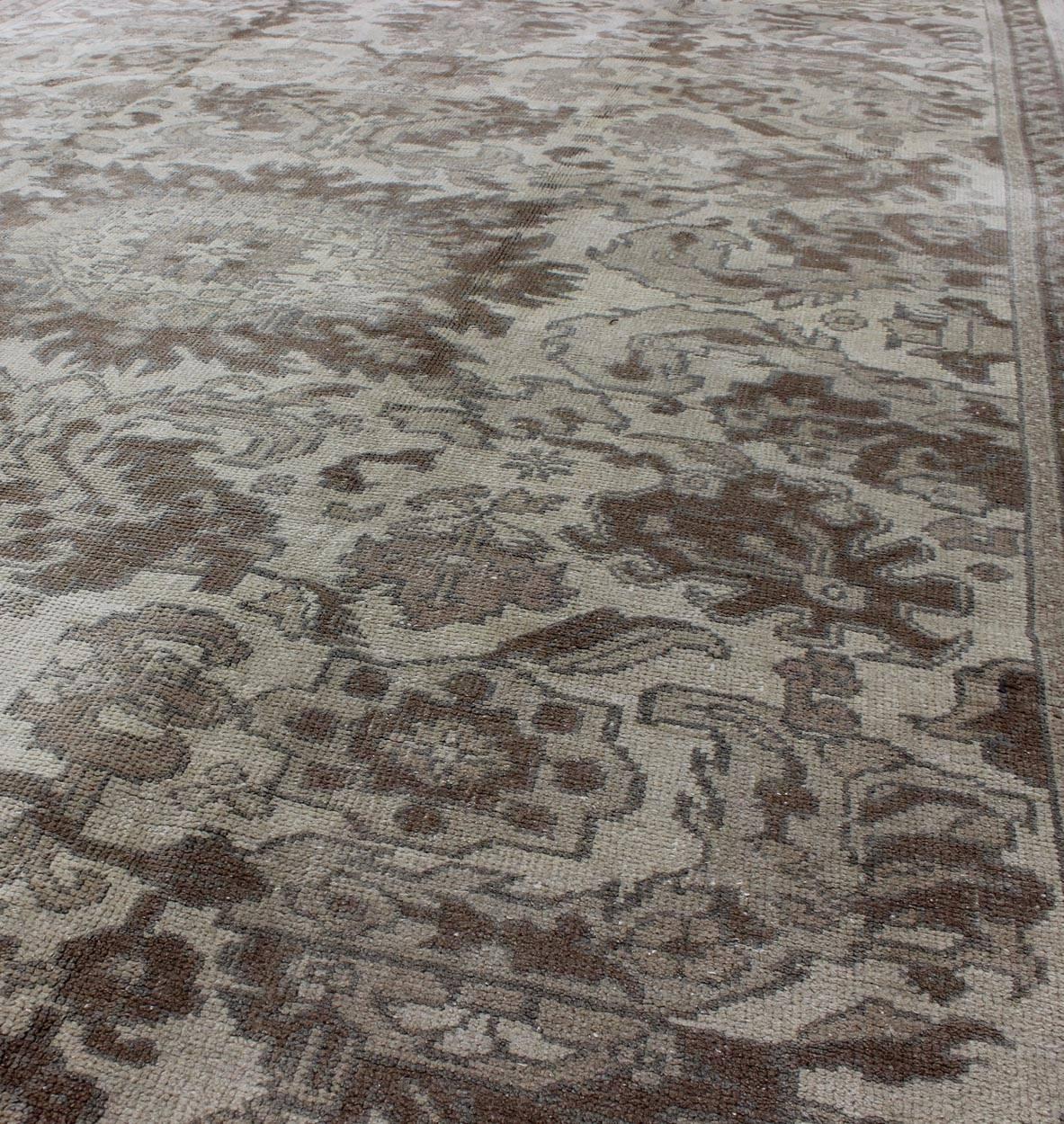 Mid-20th Century Earth Tone Vintage Turkish Oushak Rug with All-Over Floral Design For Sale