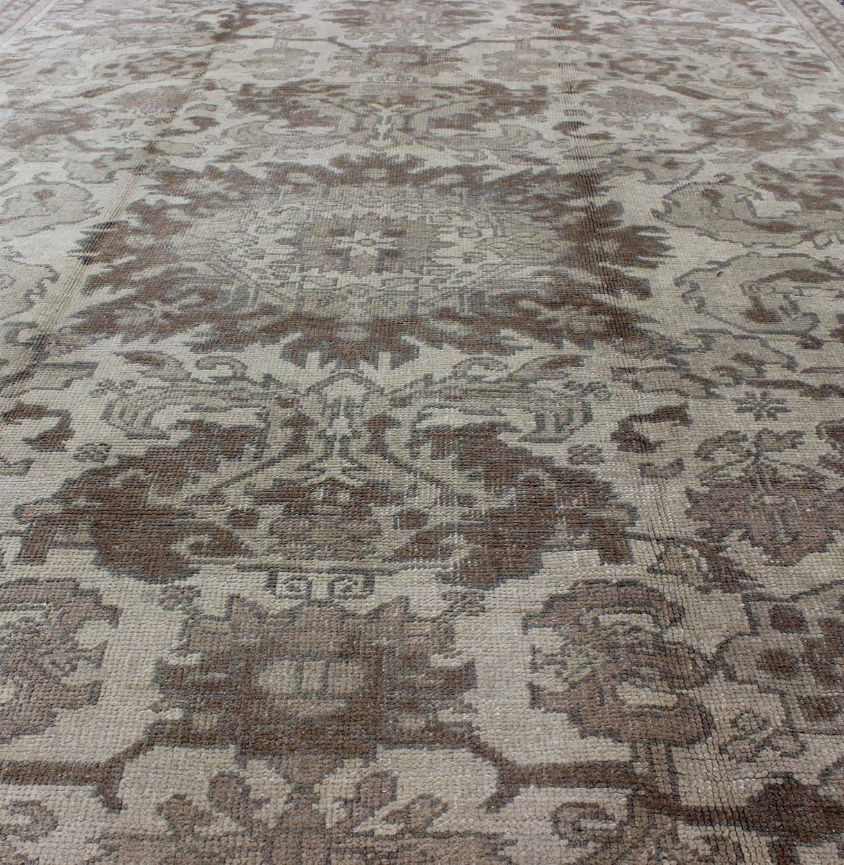 Wool Earth Tone Vintage Turkish Oushak Rug with All-Over Floral Design For Sale