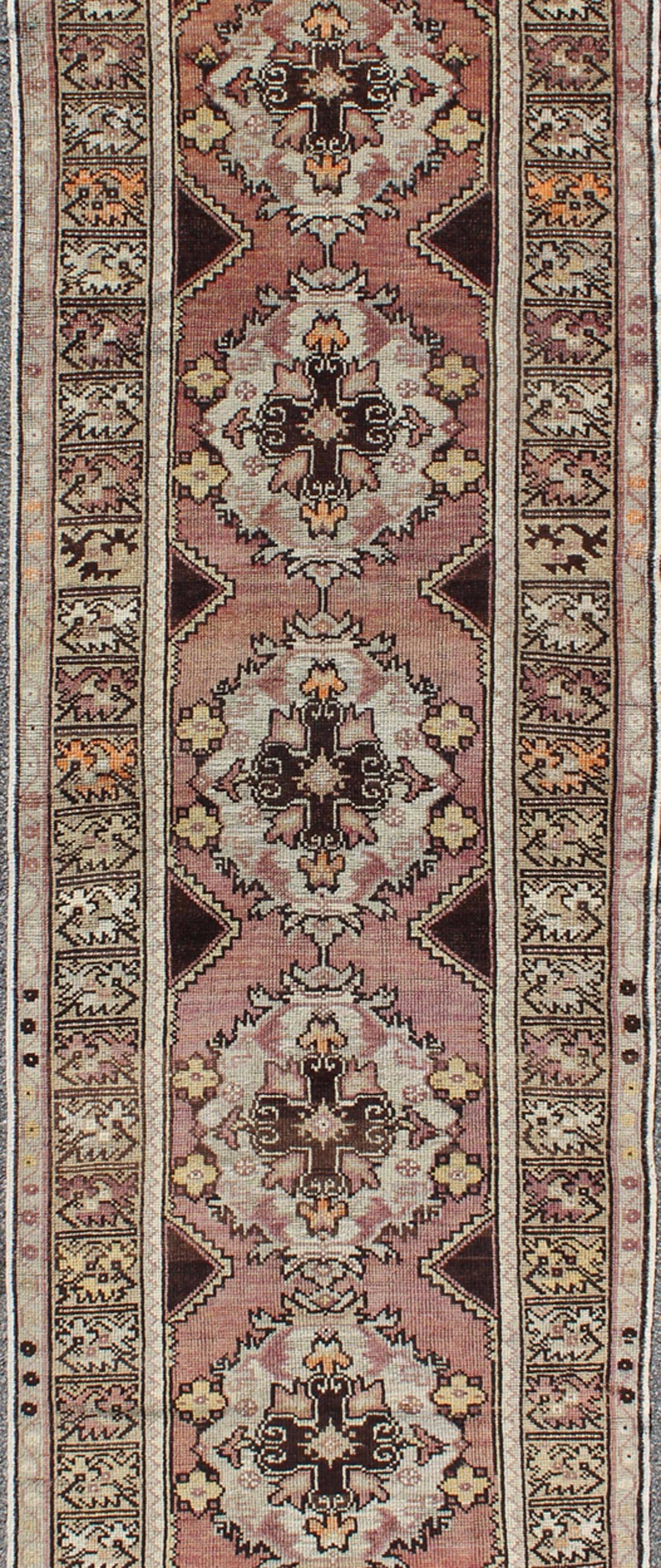 Hand-Knotted Vintage Turkish Oushak Runner with Floral Medallions in Brown Lavender and Taupe For Sale