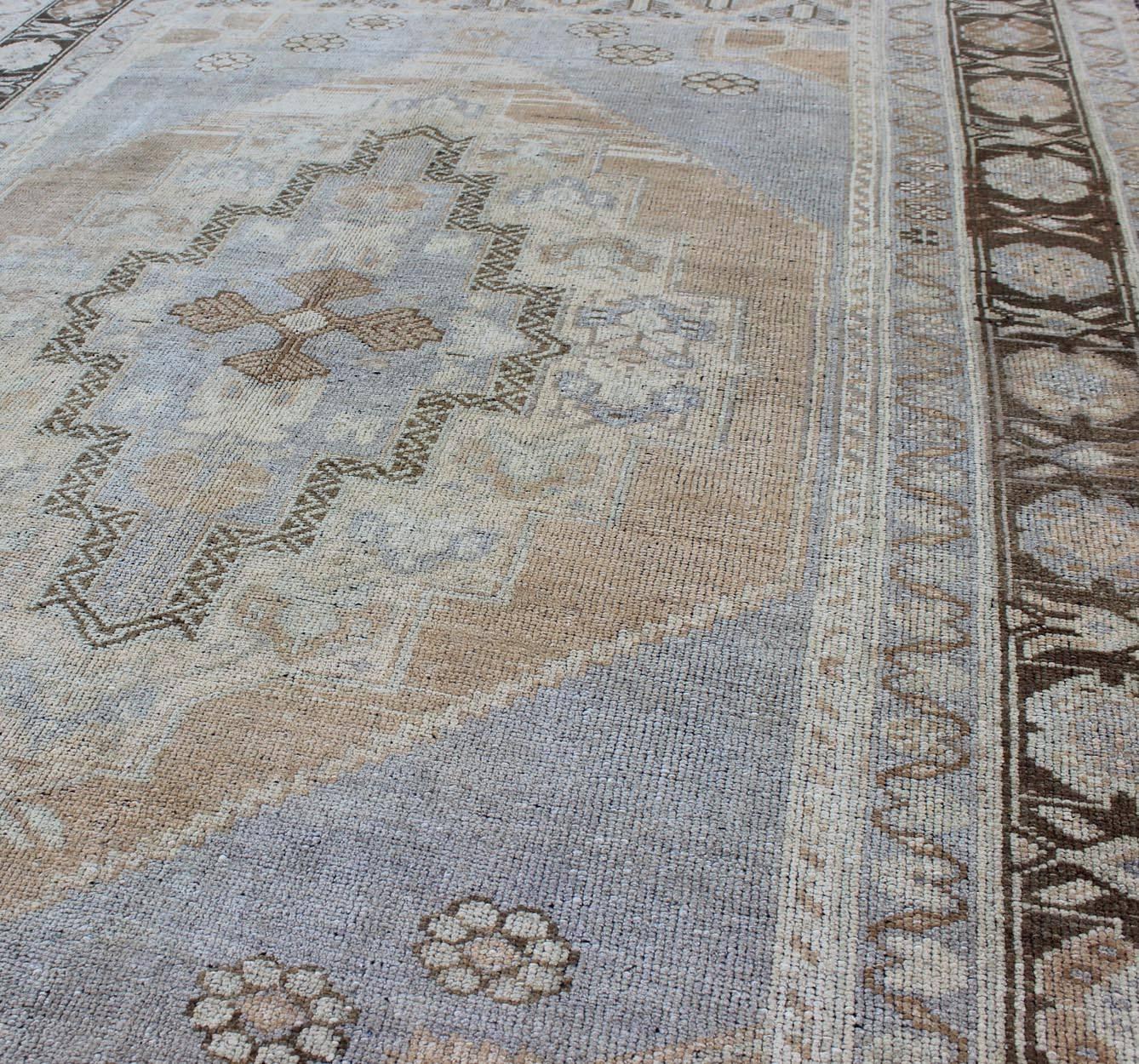 Hand-Knotted Periwinkle Blue and Tan Vintage Turkish Oushak Rug with Layered Medallion For Sale