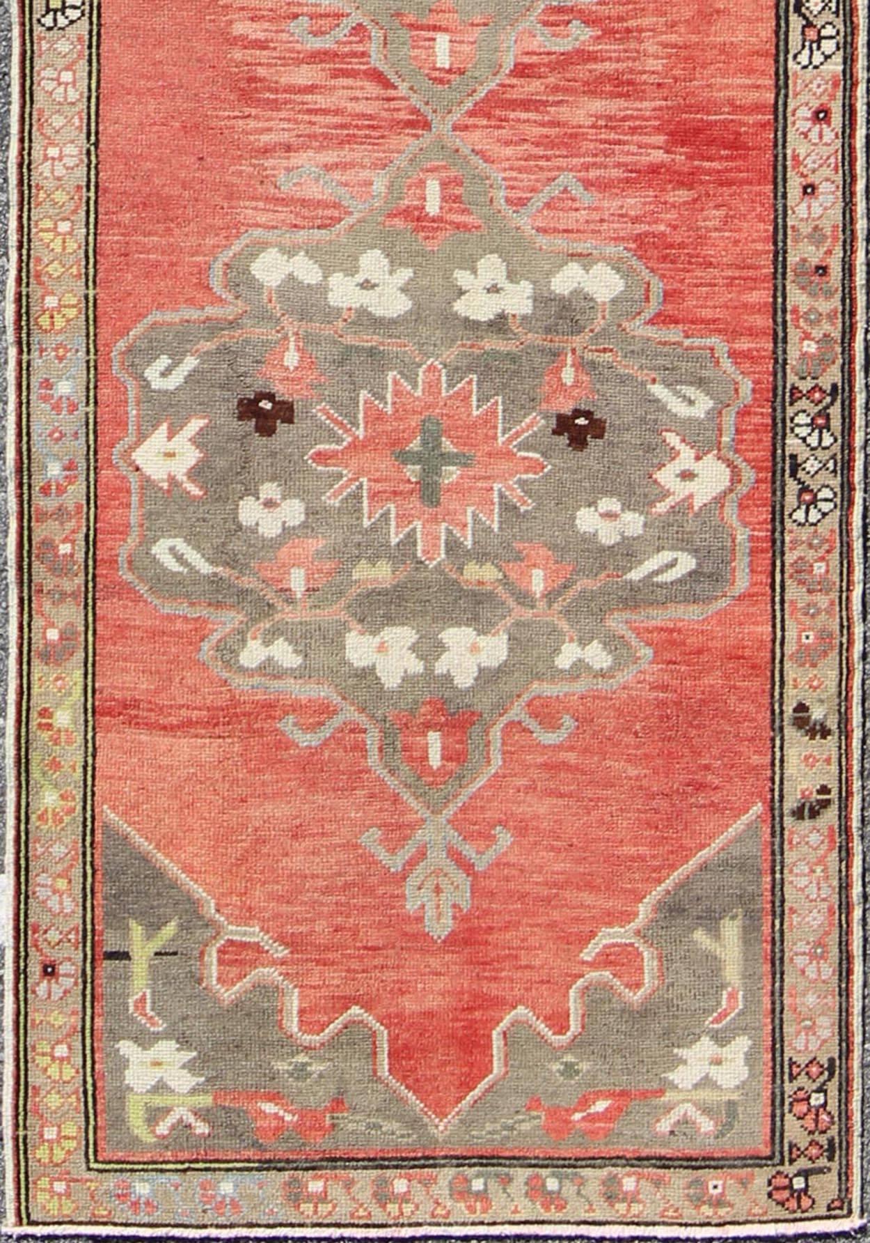Three Medallion vintage Turkish Oushak runner in red, charcoal, and grey, rug tu-ugu-95168, country of origin / type: Turkey / Oushak, circa 1940.

This beautiful vintage Oushak runner from 1940s Turkey features a Classic Oushak design, which is