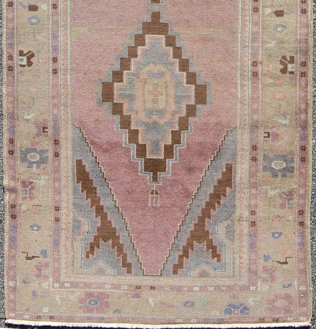 Midcentury Turkish Oushak rug with diamond medallions in lavender, pink, brown, cream and blue rug tu-ugu-136009, country of origin / type: Turkey / Oushak, circa 1950.

This beautiful vintage Oushak runner from 1950s Turkey features a geometric