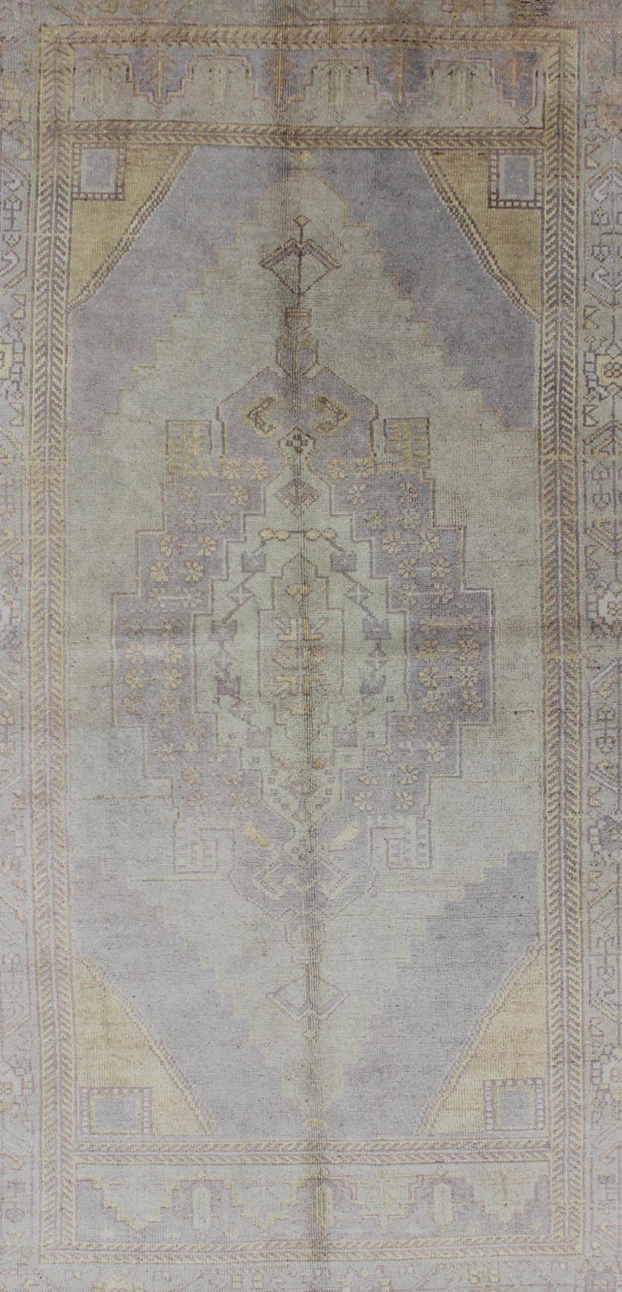 Hand-Knotted Muted Vintage Turkish Oushak Rug with Medallion Geometric Design For Sale